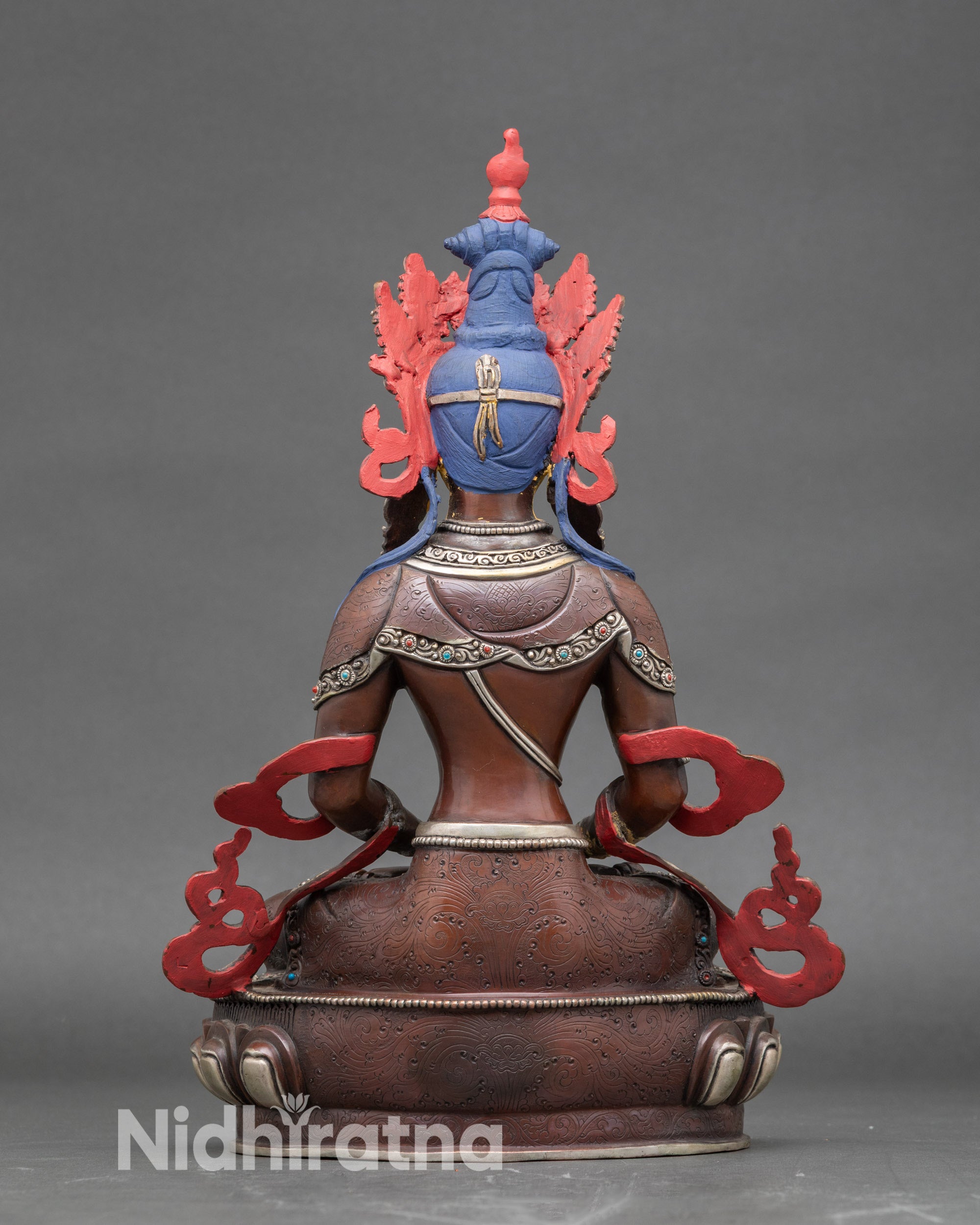 Back view of Amitayus silver-plated statue, showcasing detailed Newari lost-wax artistry and Tibetan Buddhist symbolism