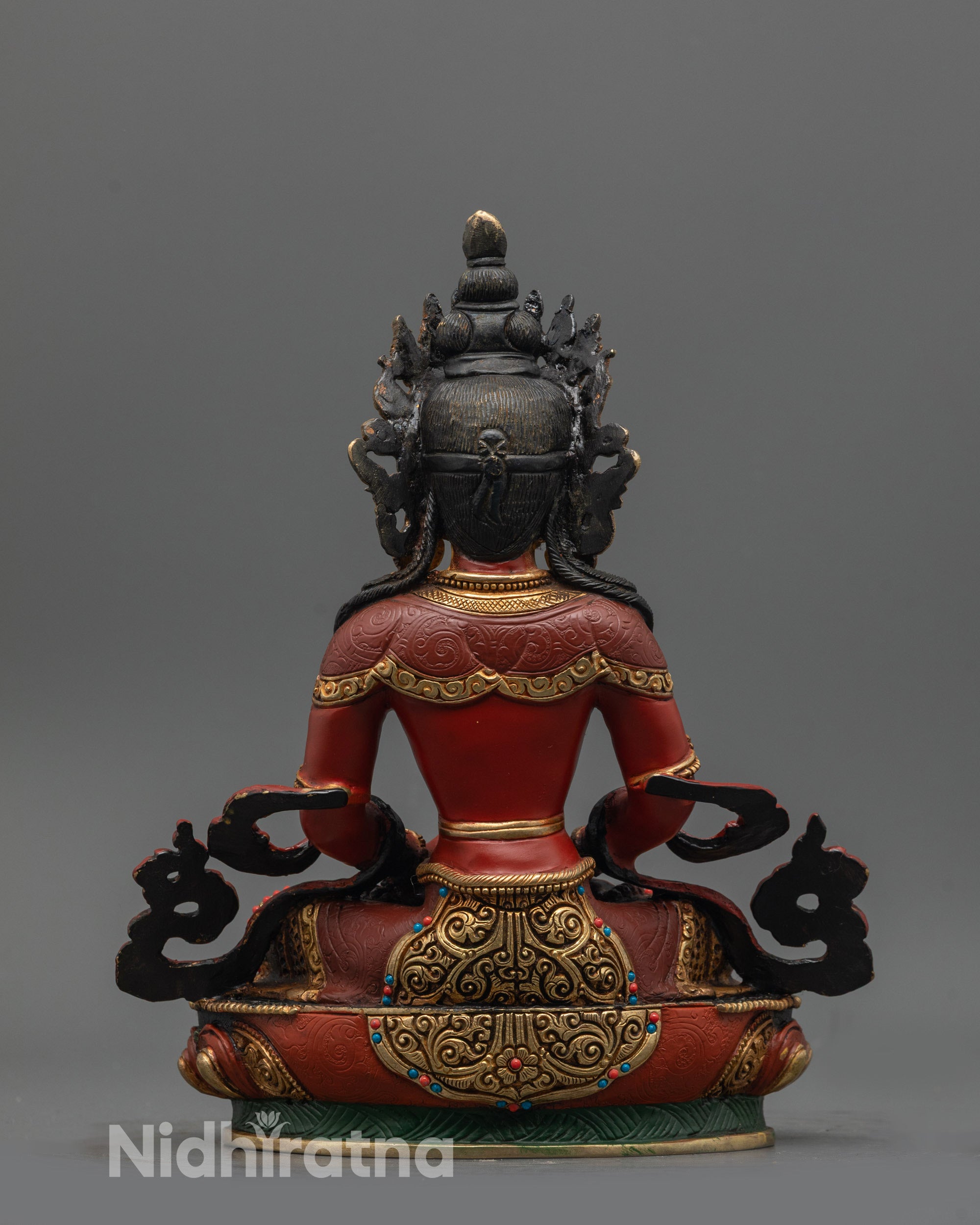 Back view of Amitayus statue highlighting intricate carvings and vibrant gold-plated finish
