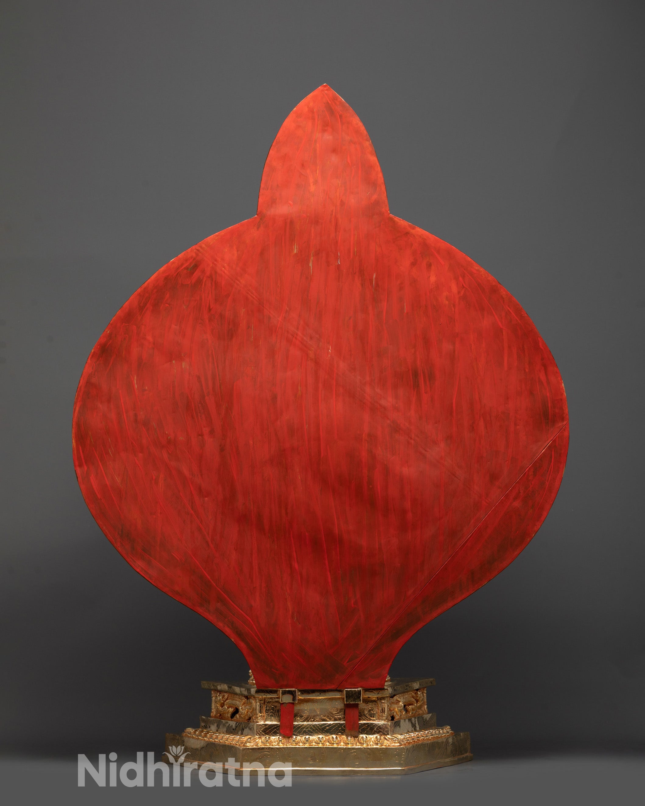 Back view of Avalokiteshvara statue displaying carved arms and lotus seat on moon disc