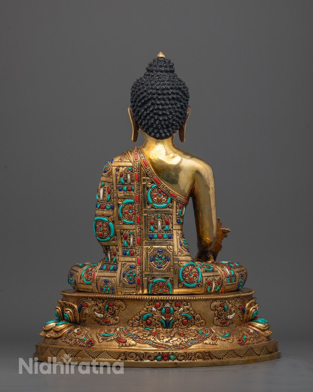Back view of Bhaisajyaguru Healing Buddha Statue with intricate lost wax carvings