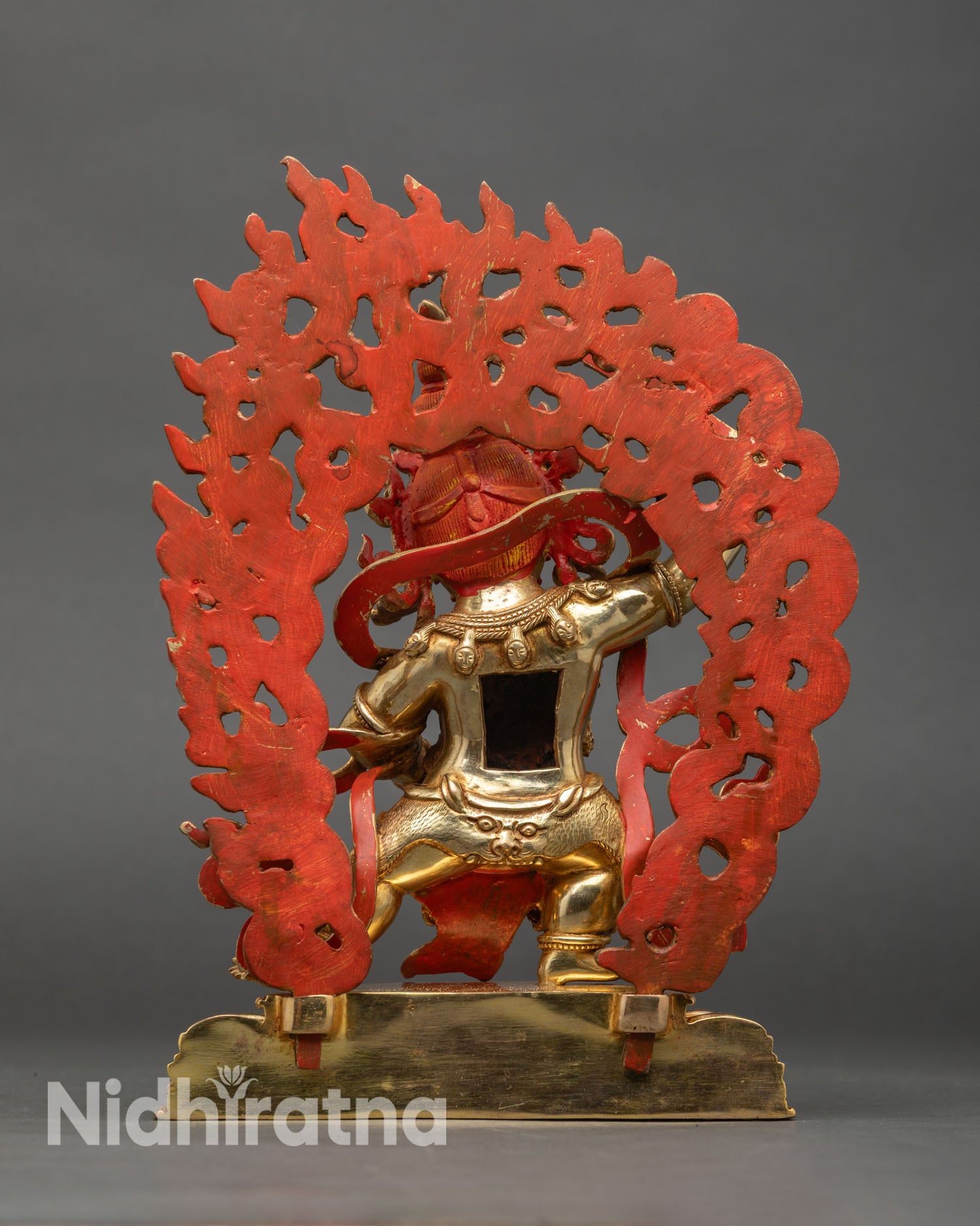 back-view-of-black-manjushri-statue-intricately-designed-halo-and-ornamental-details