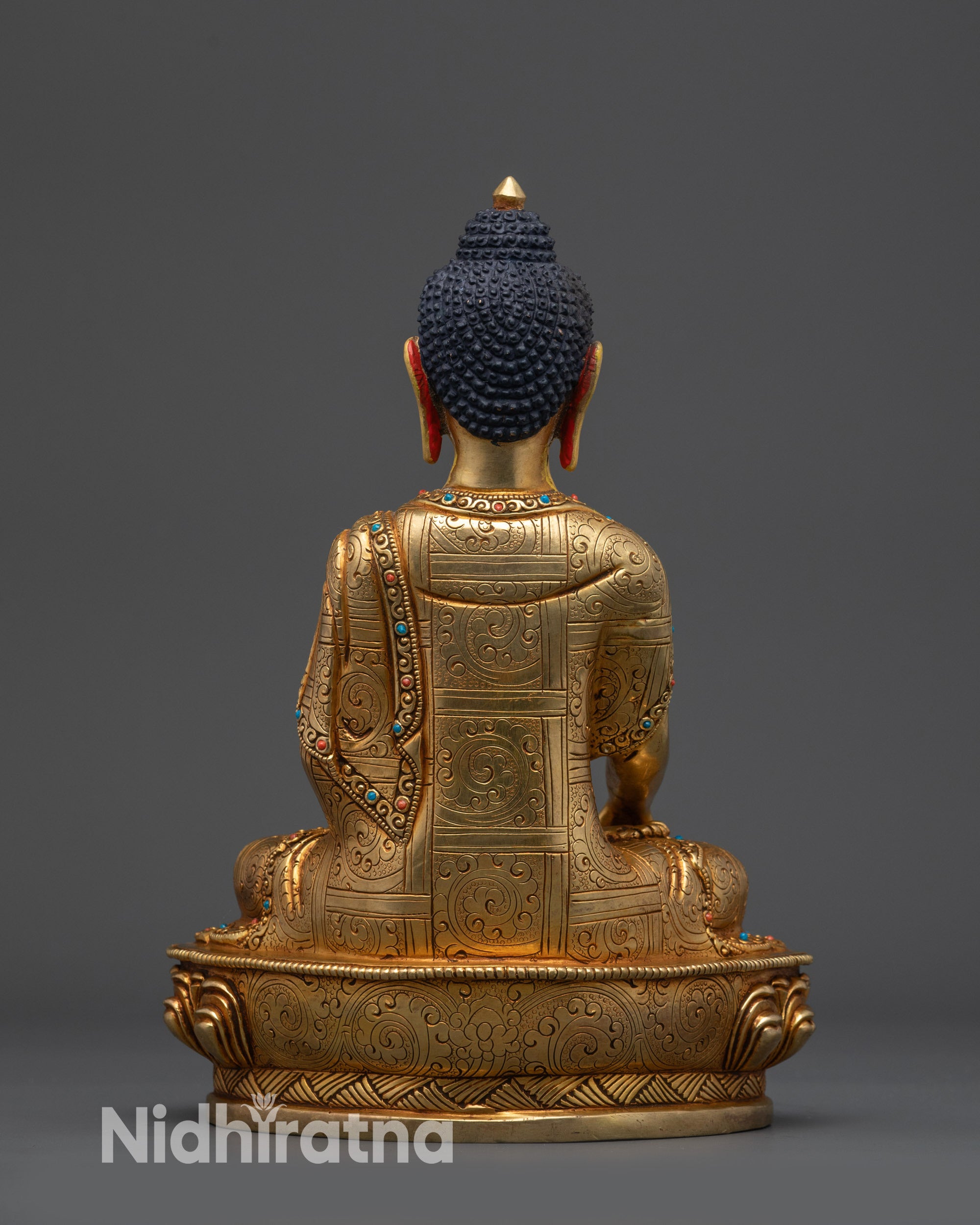Back view of Bodhi Shakyamuni Buddha showing floral motifs and gold-gilded craftsmanship