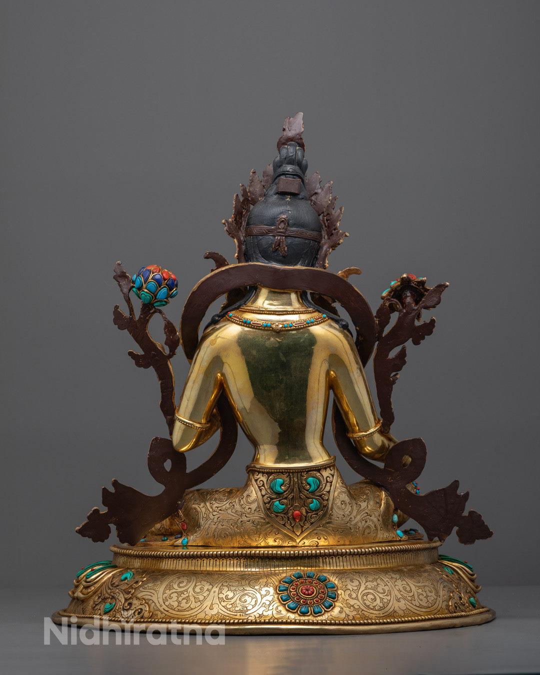 Back view of Buddhist Green Tara Sculpture showing hollow consecration chamber and detailed carvings