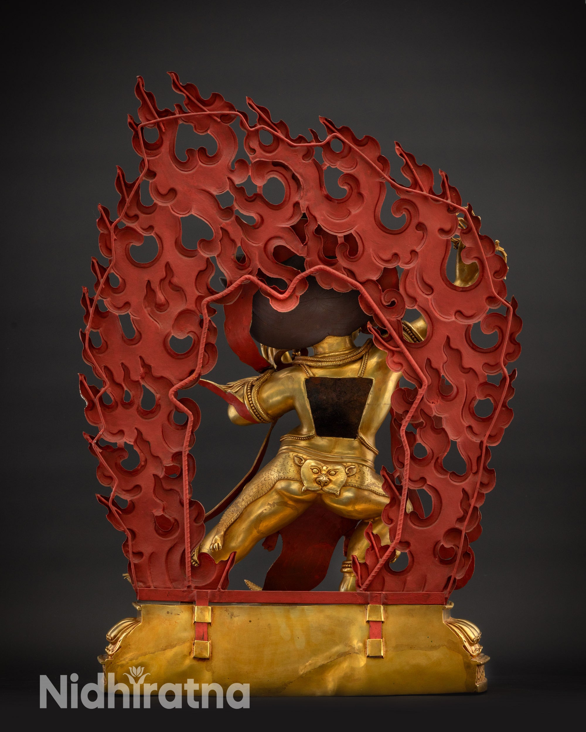 Back view of Chana Dorje Vajrapani Statue showing halo and flowing garments