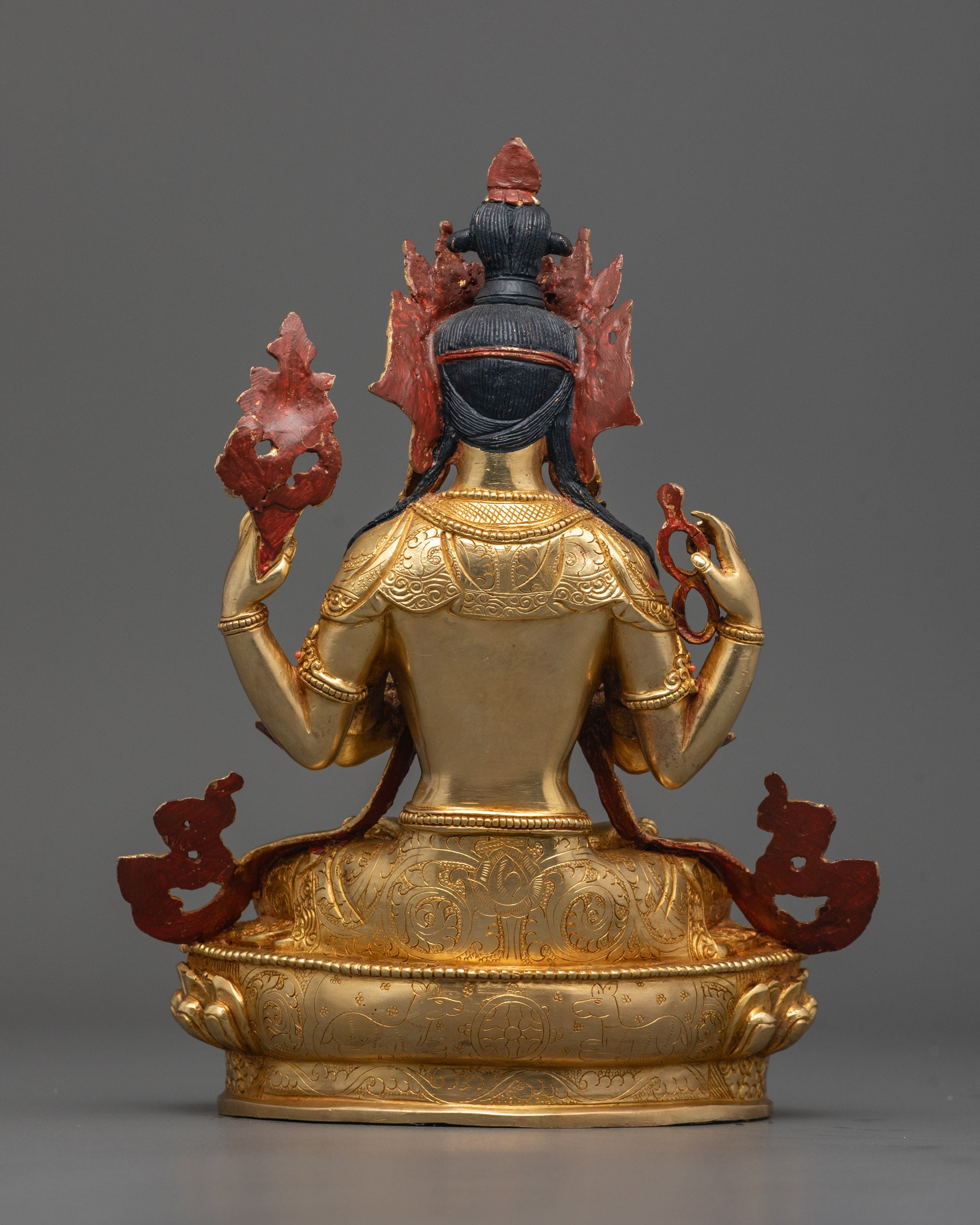 Back view of Chenrezig Bodhisattva statue highlighting intricate carvings and copper base