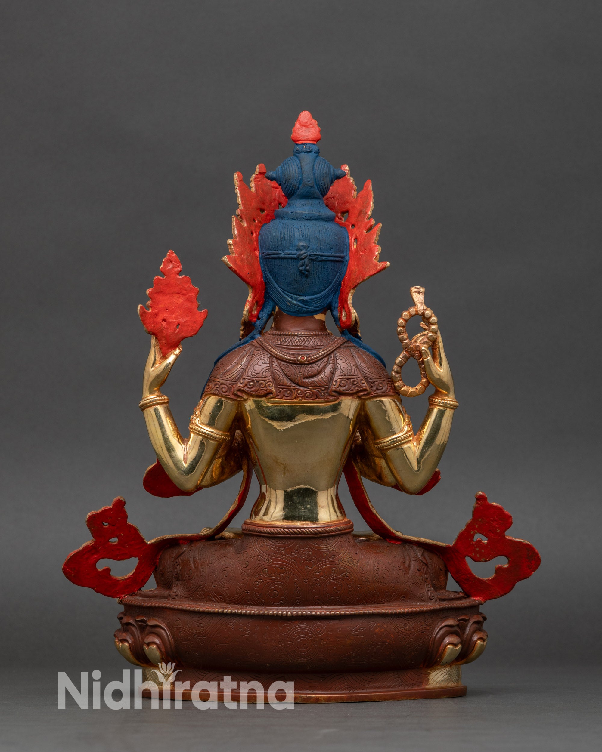 Back view of Chenrezig Buddhist statue, sacred object details and intricate lost-wax casting