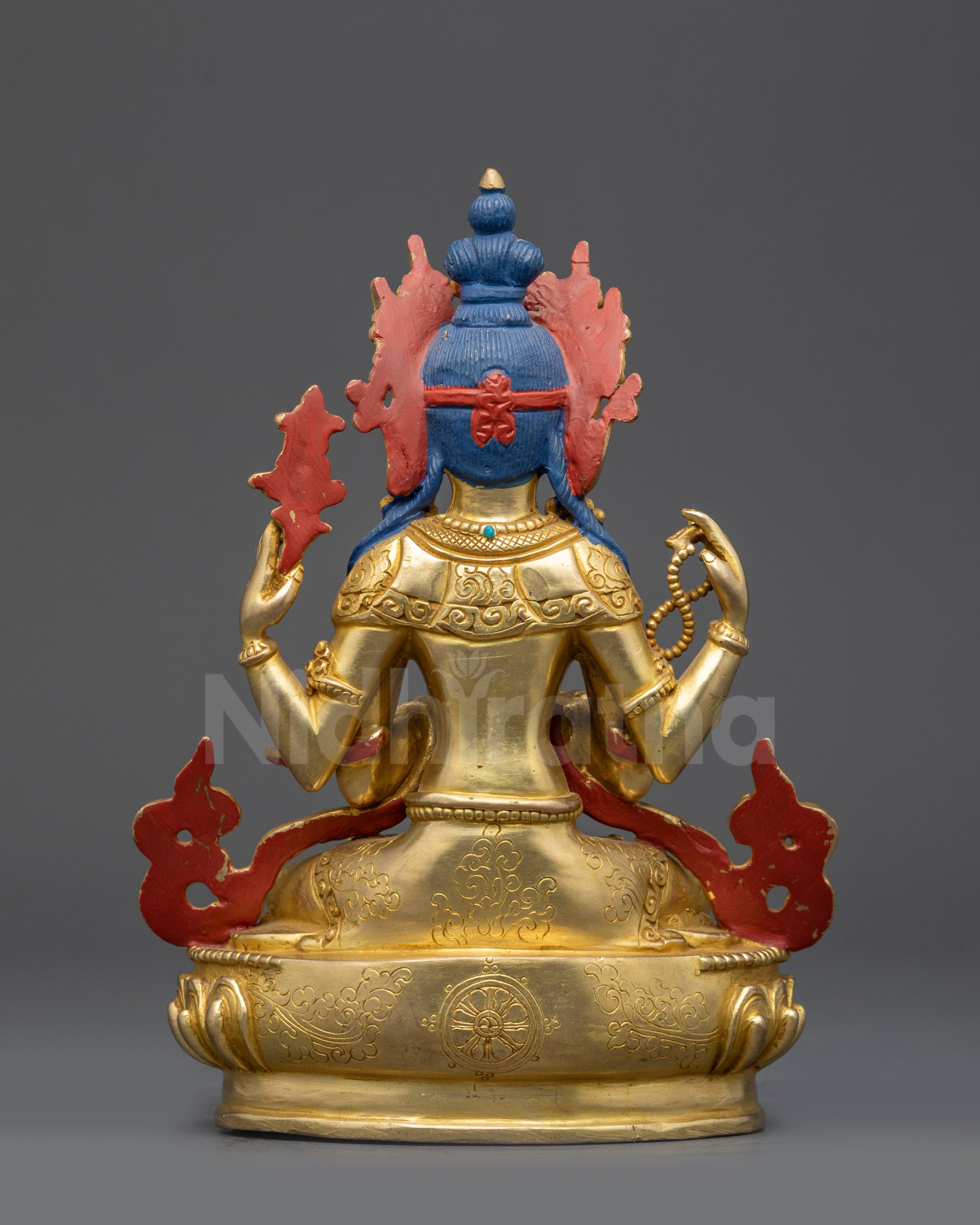 Back view of Chenrezig Statue highlighting carved robes and gold fire-gilded base