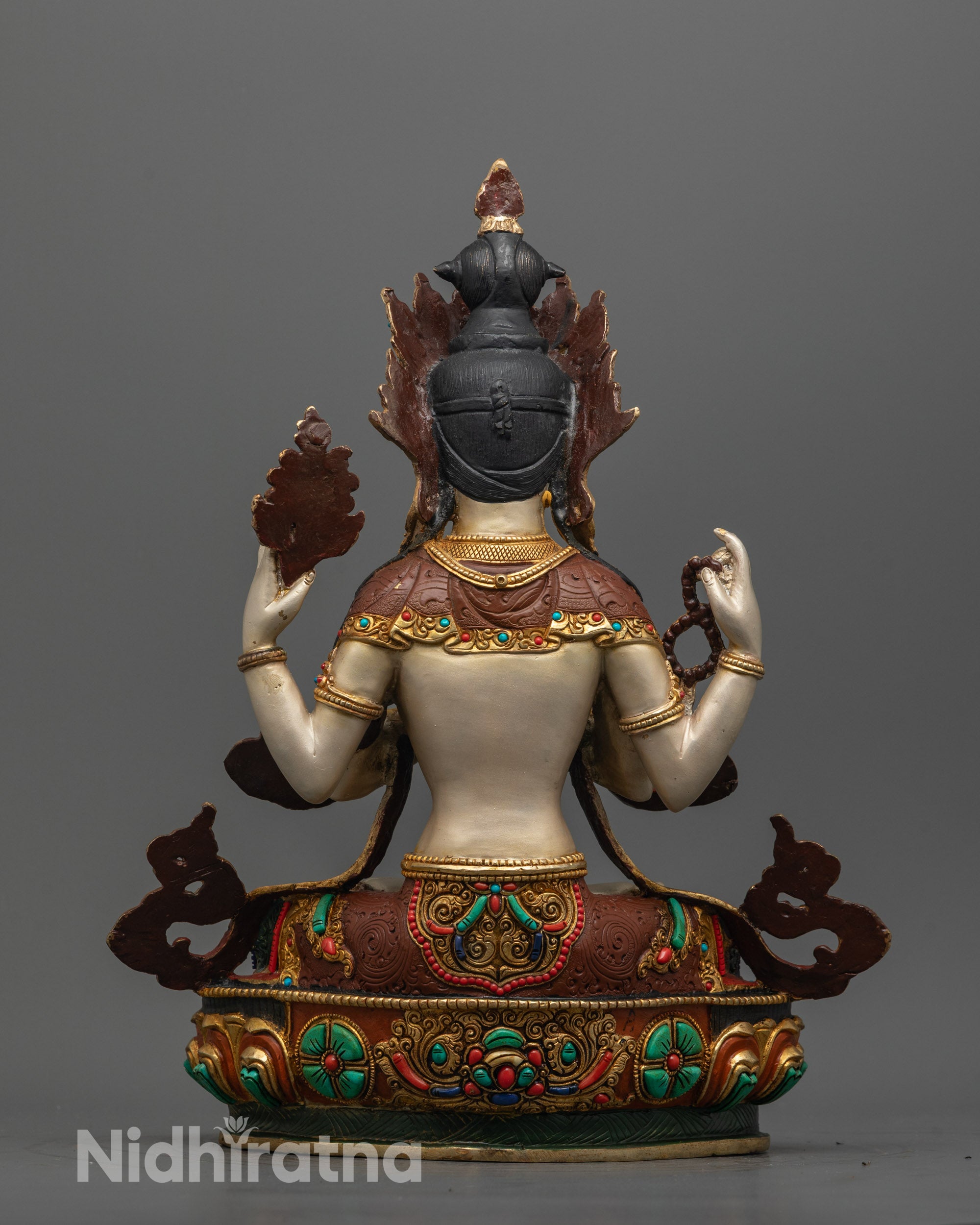 Back view of Chenrezig Statue showing intricate copper craftsmanship