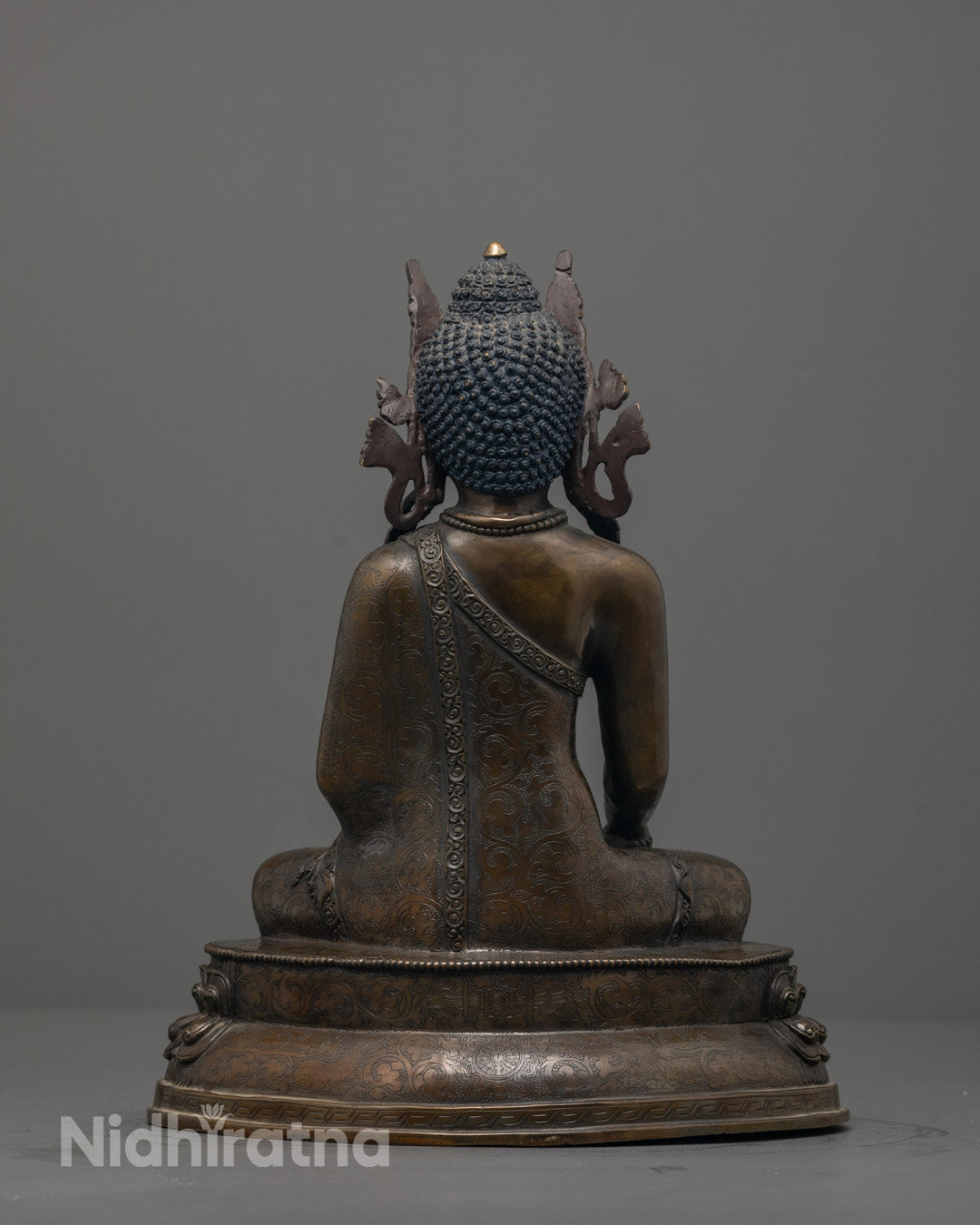 Back view of Crowned Shakyamuni Buddha Statue highlighting detailed craftsmanship