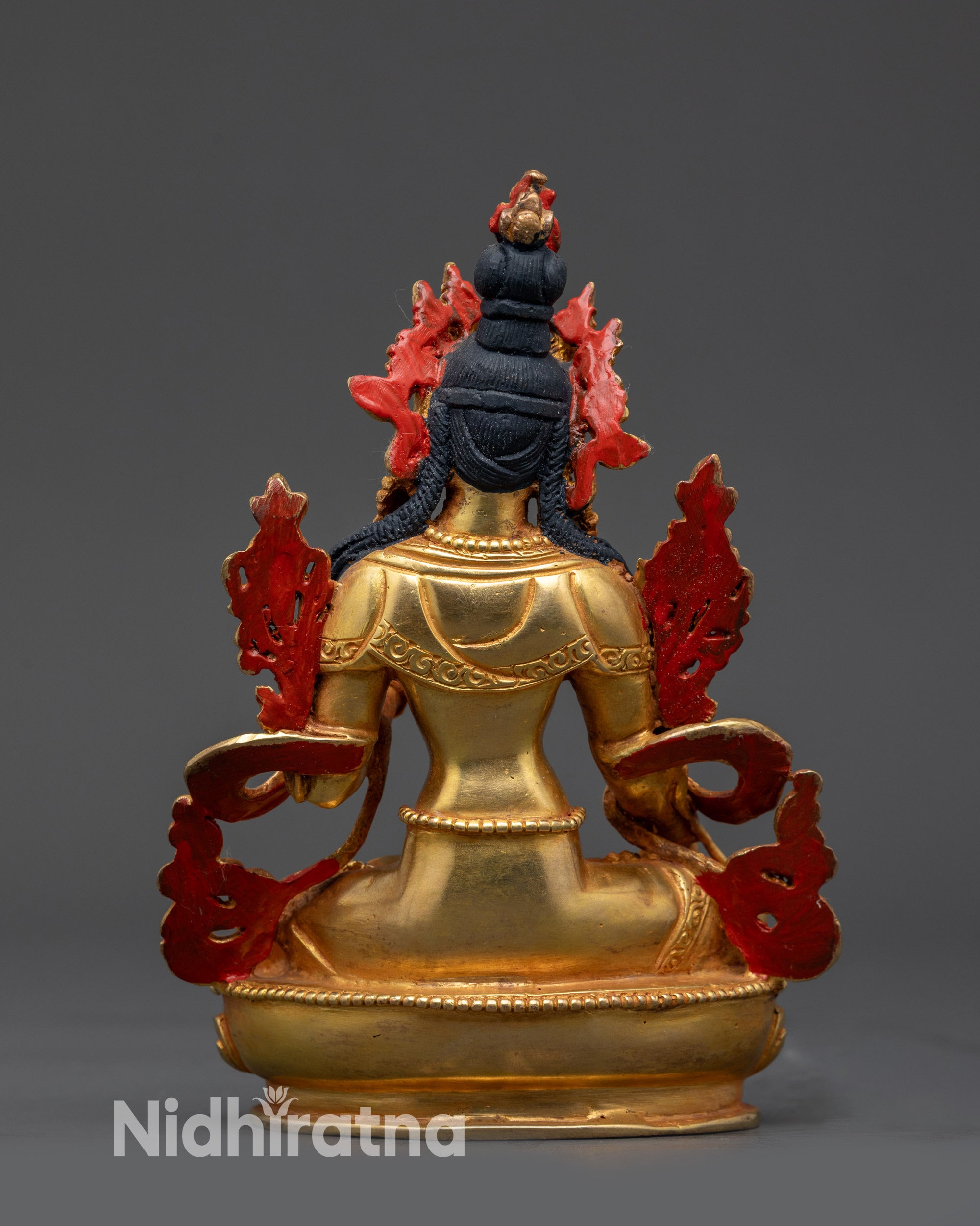 Back view of Divine Sapta Lochani statue highlighting flowing robes and meditative posture