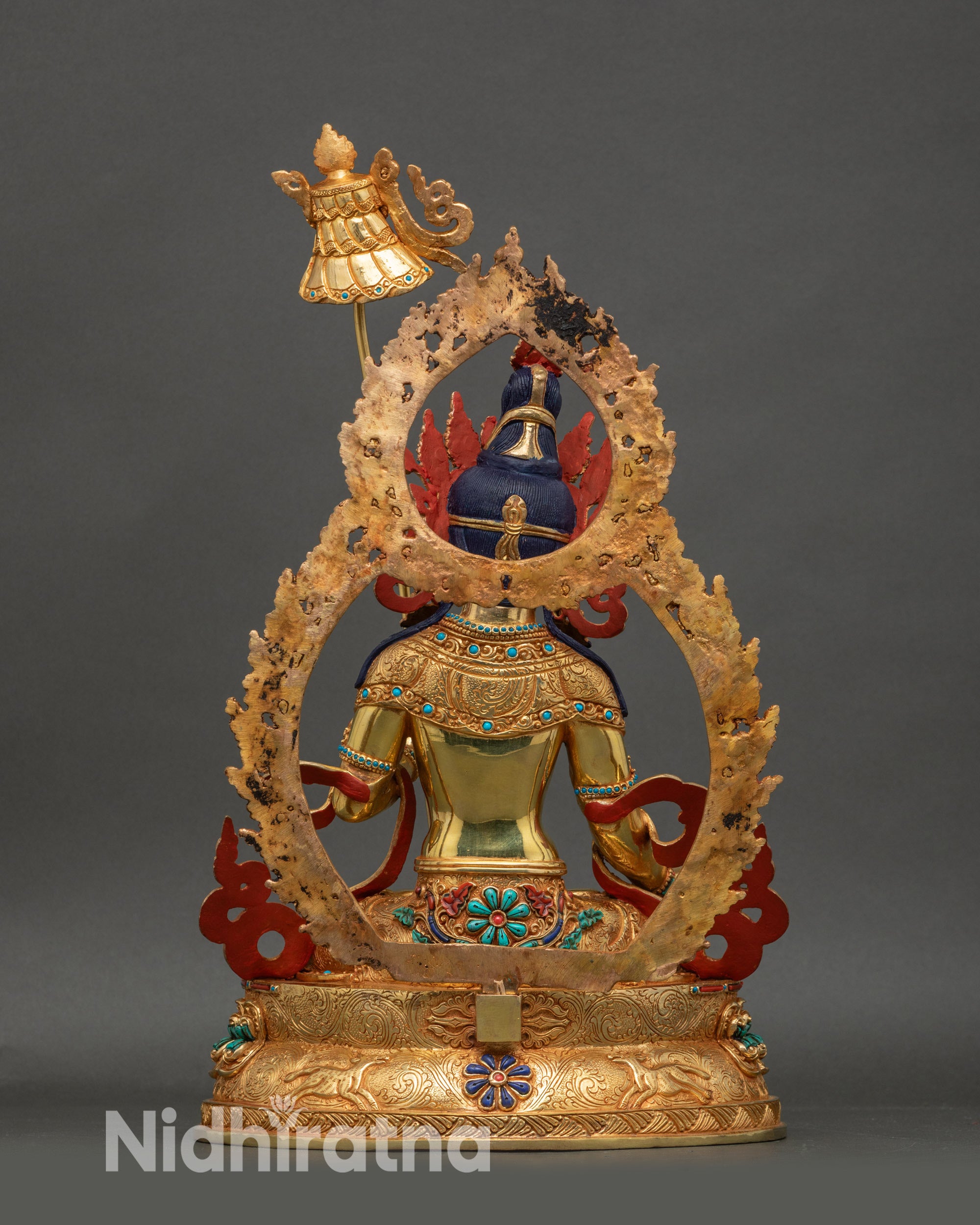 Back view of Dukar statue highlighting double-layered lotus pedestal and halo