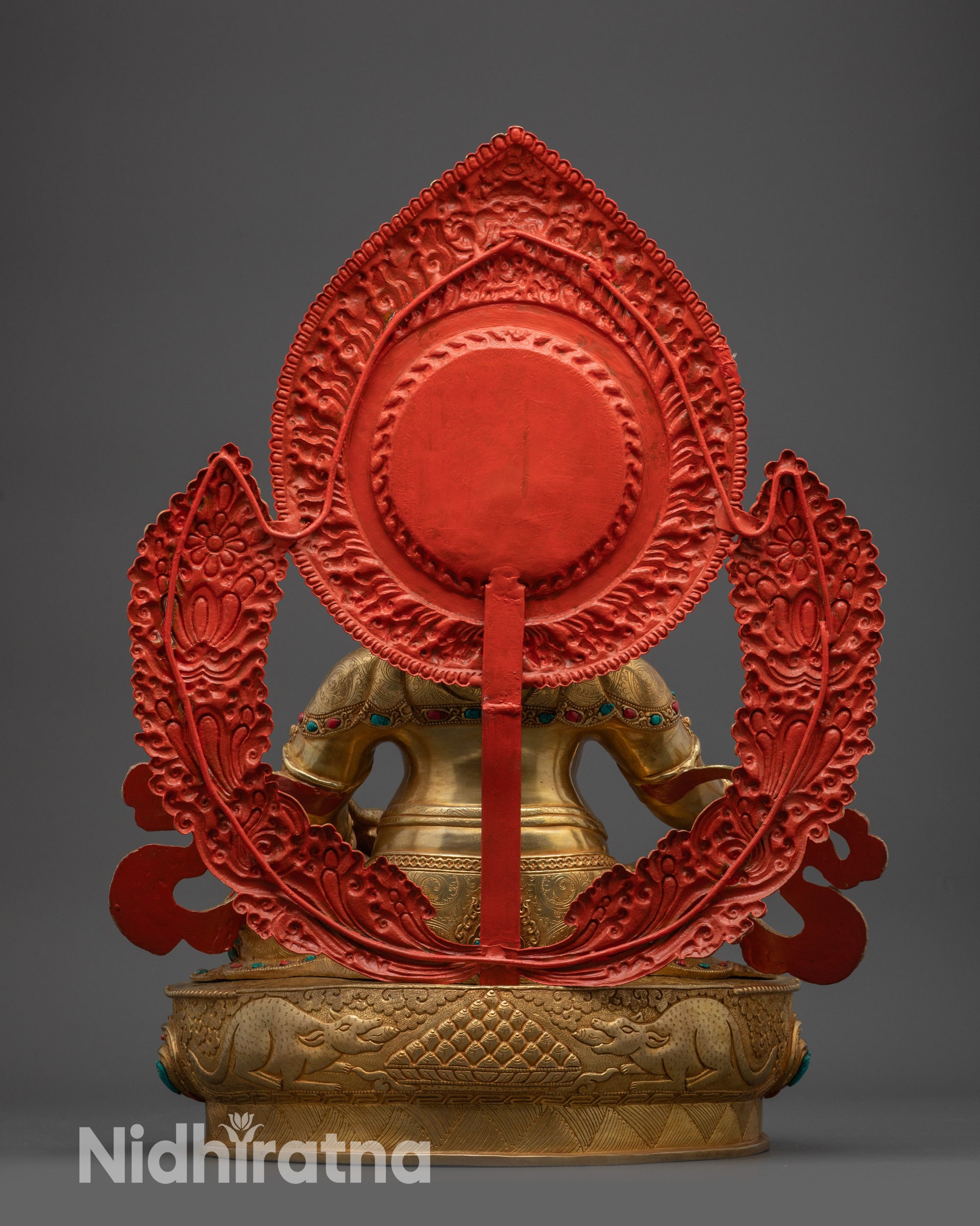 Back view of Dzambhala Sculpture with halo and ornate carvings from Nepal