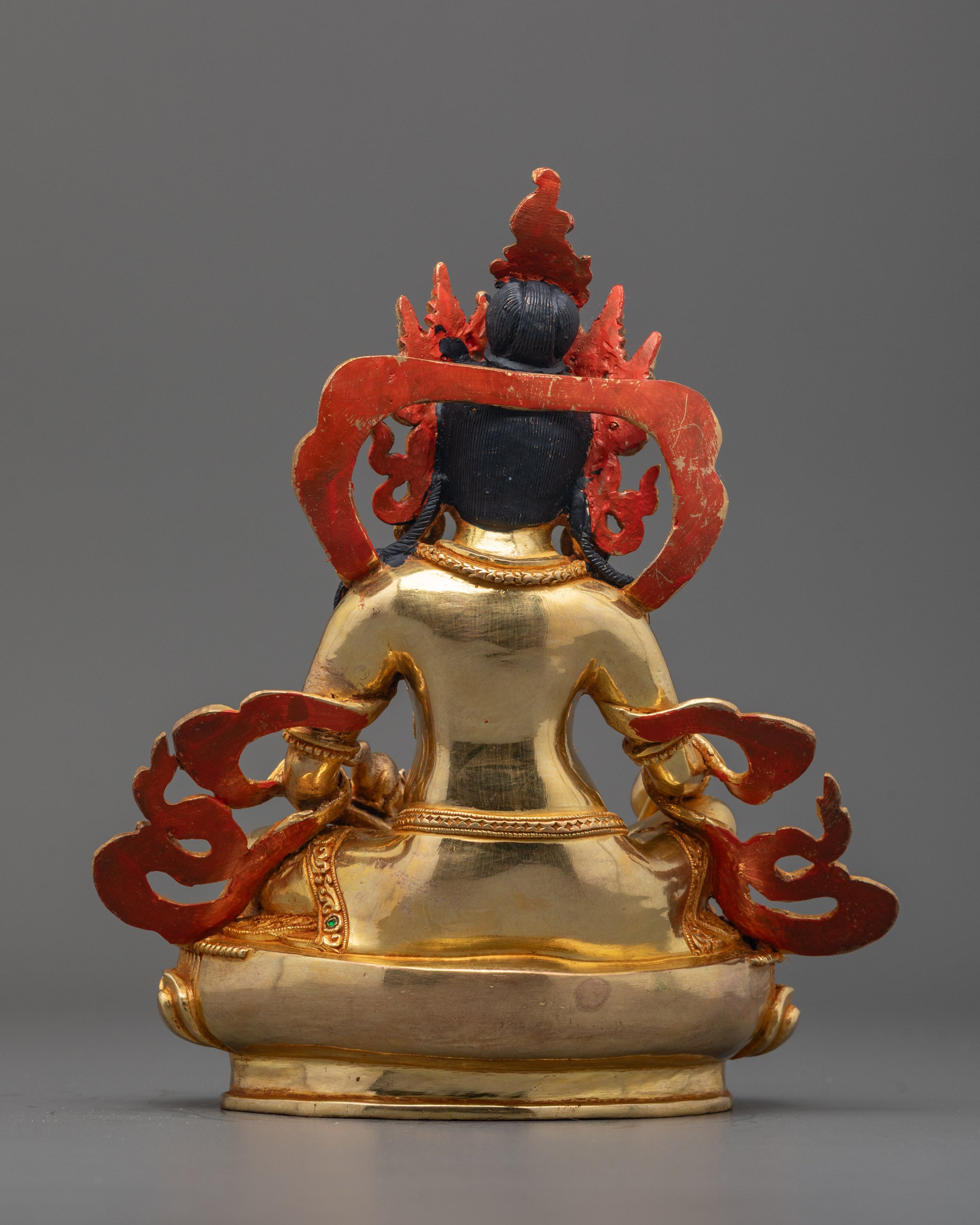 Back view of Dzambhala Statue highlighting ornate robe carvings and handcrafted details