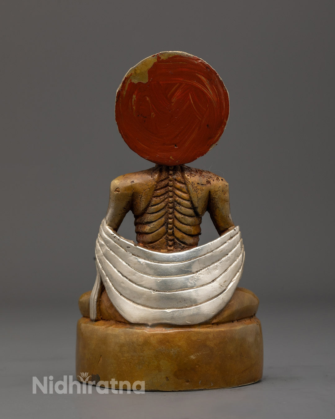 Fasting Buddha sculpture highlighting oxidized copper texture and silver-plated detailing crafted by Nepali artisan