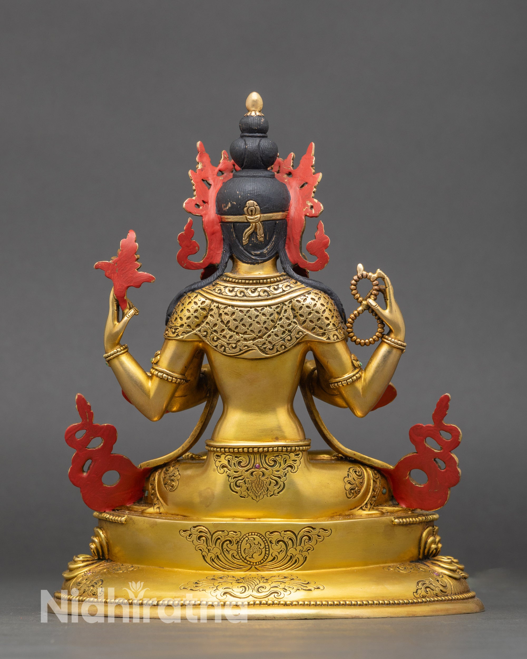 Back view of Four-Armed Chenrezig statue with detailed crown and ornate lotus base