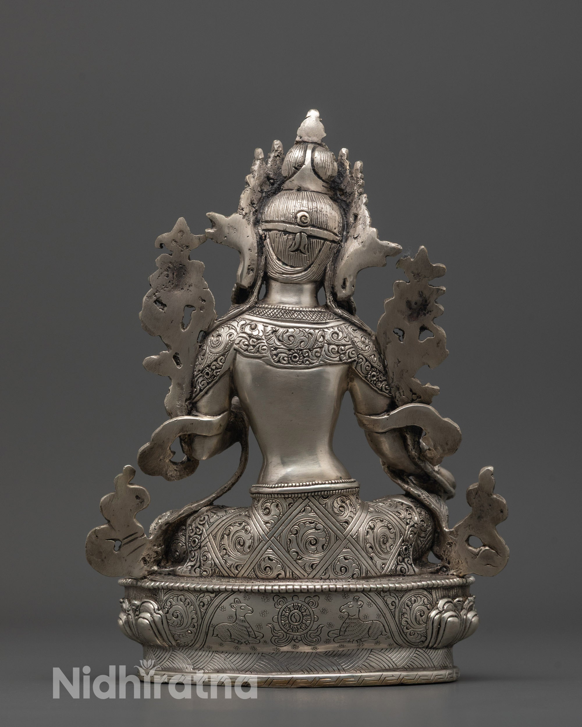 Back view of Green Tara Sculpture holding lotus flower, handcrafted Buddhist art from Nepal