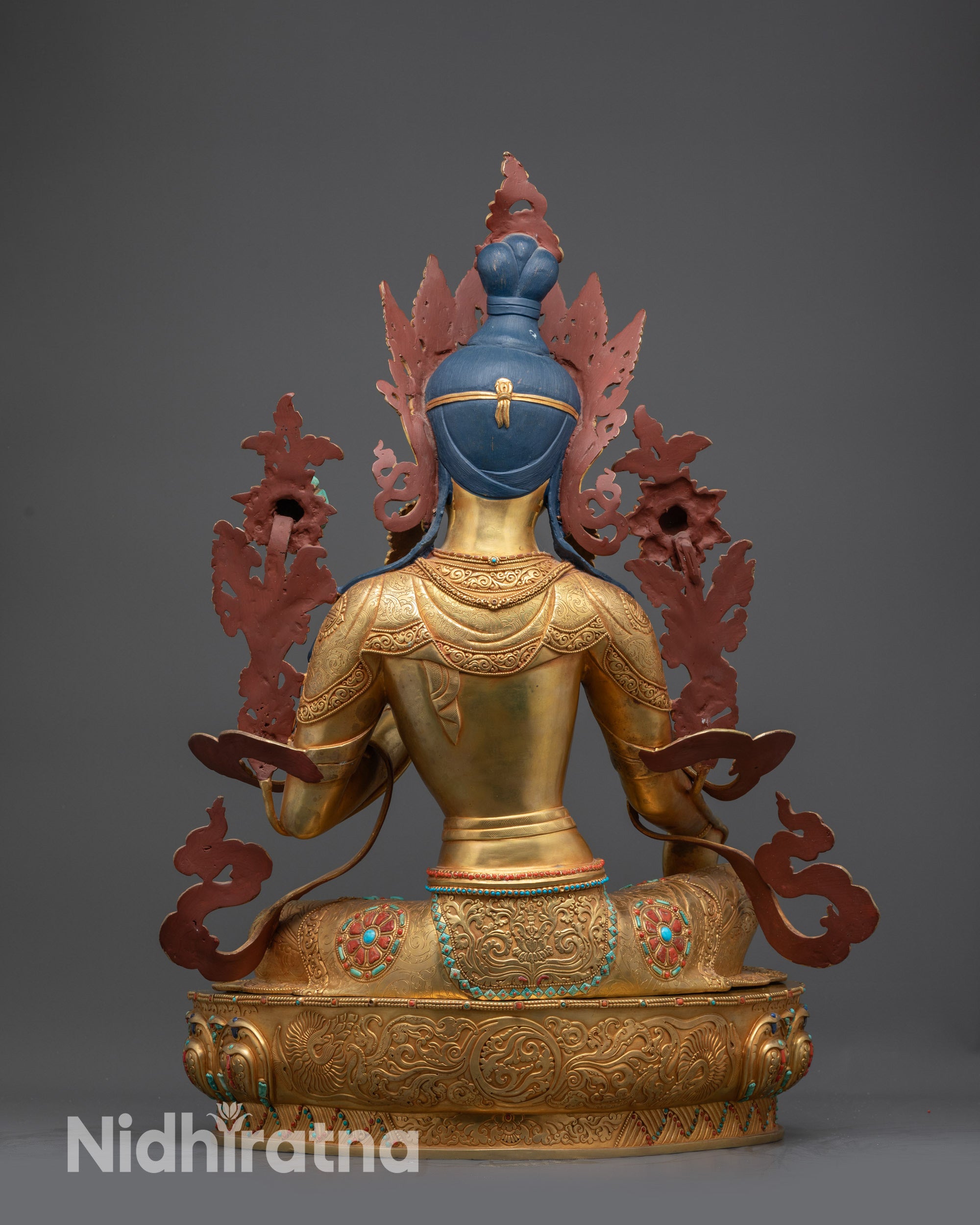 Back view of Green Tara Statue displaying intricate robes and lotus throne details
