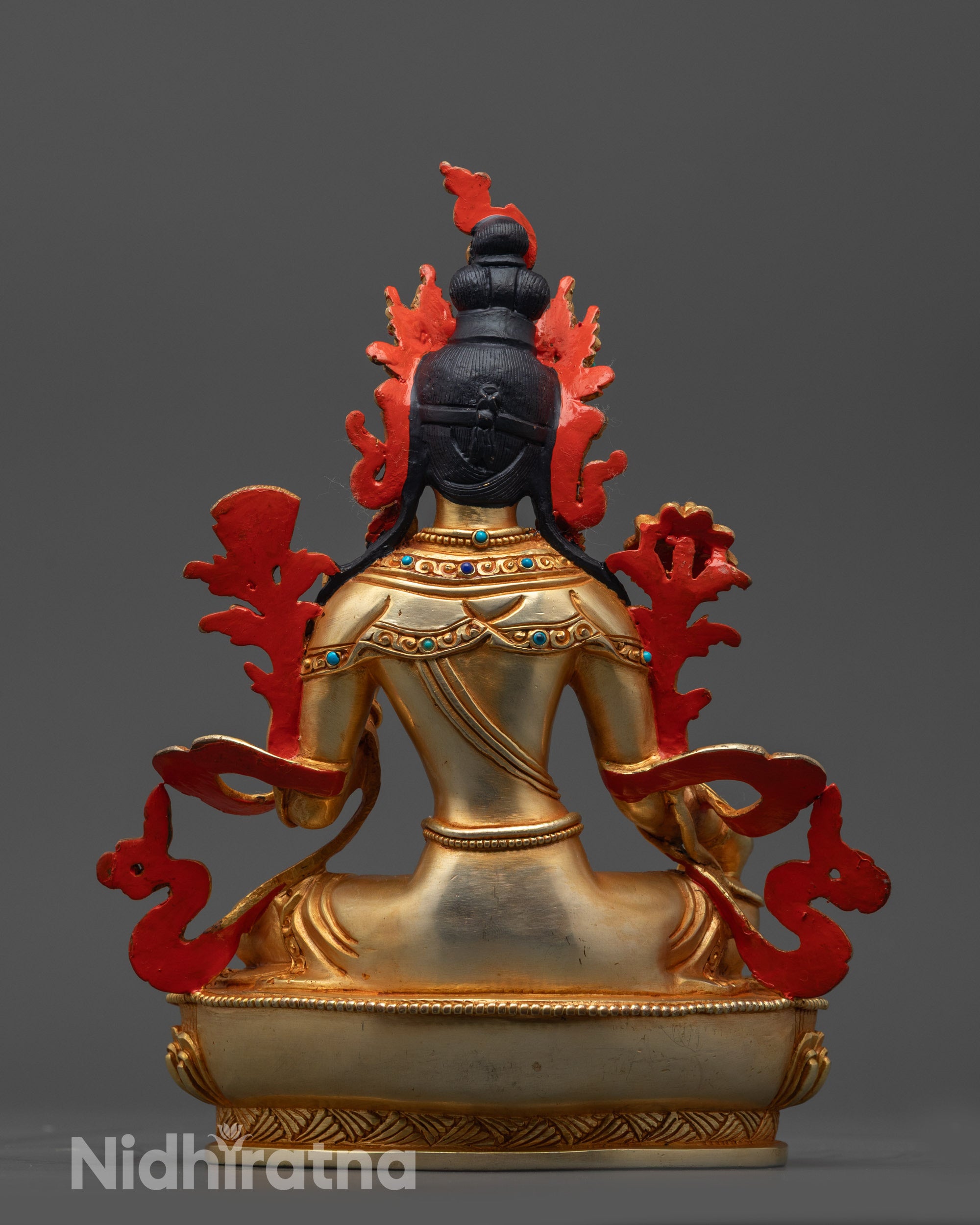 Back view of Green Tara Statue displaying lotus seat patterns and detailed carvings