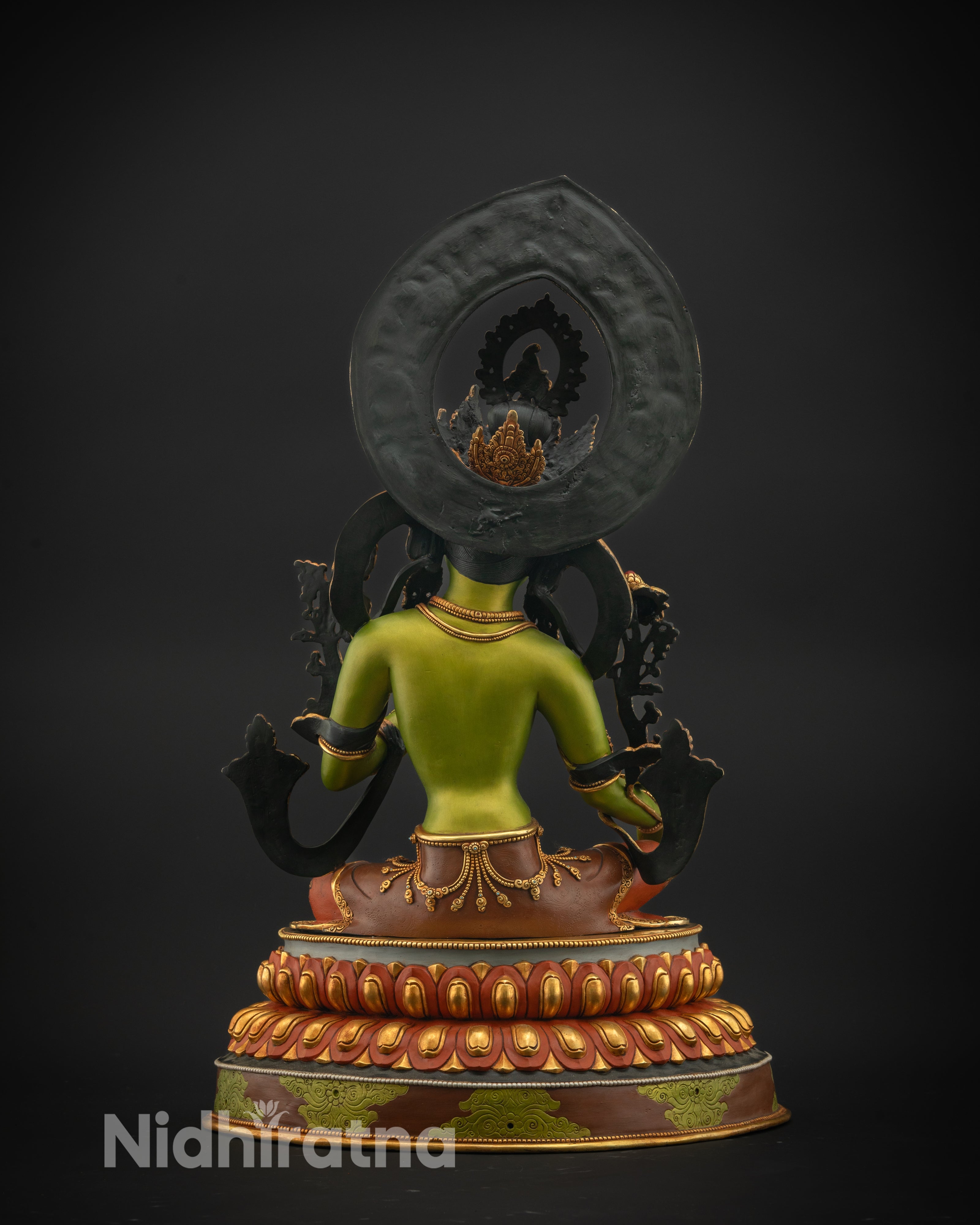 Back view of Green Tara Statue featuring ornate halo and miniature Tara figurines