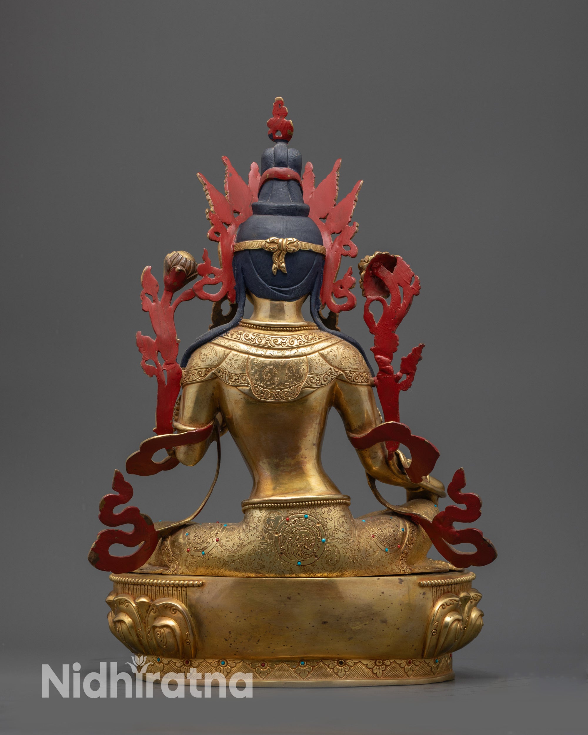 Back view of Green Tara Statue highlighting carved robe, jewelry, and gold fire-gilded base