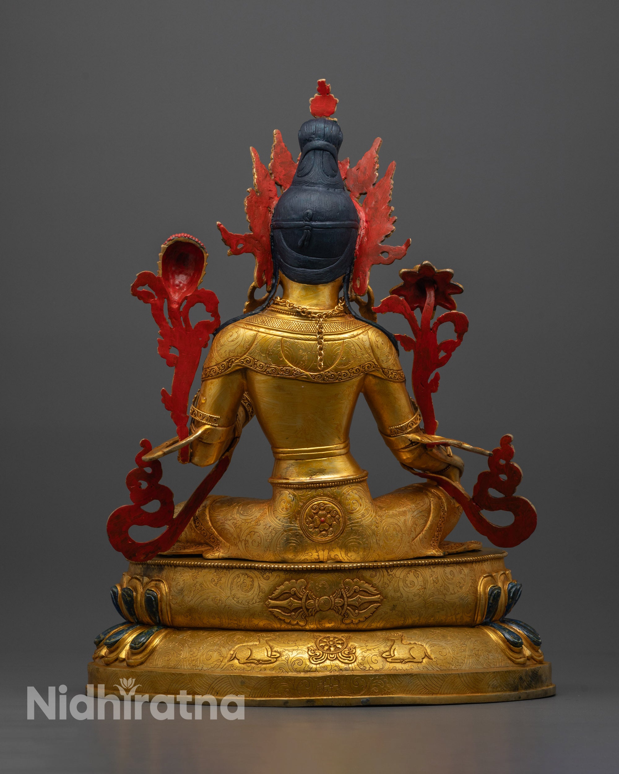 Back view of Green Tara Statue highlighting crystal finish and intricate throne carvings