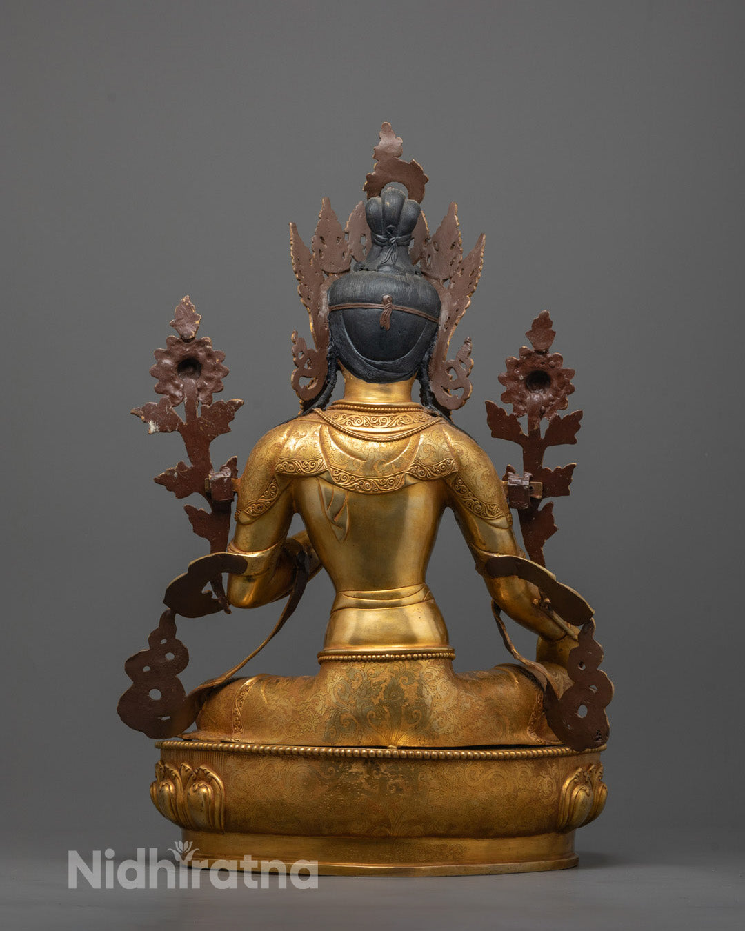 Back view of Green Tara Statue highlighting intricate carvings