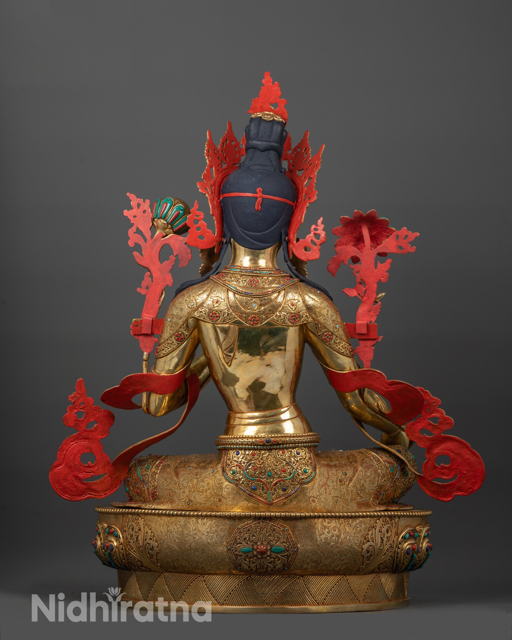 Back view of Green Tara Statue showing gold-plated robe patterns