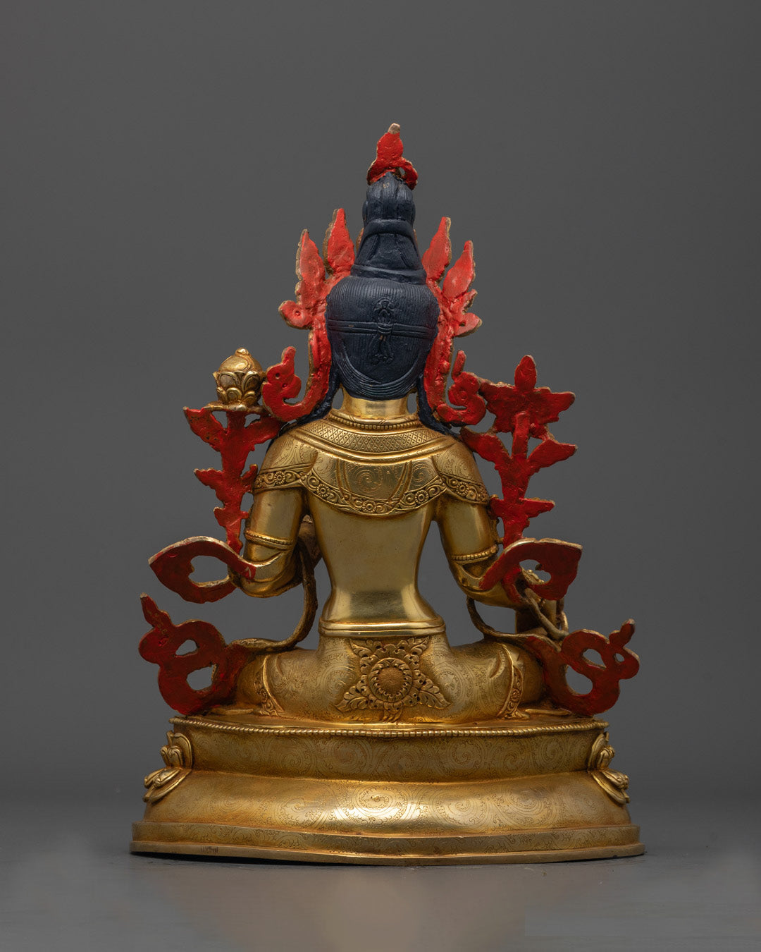 Back view of Green Tara statue featuring detailed patterns and 24K gold fire-gilded finish