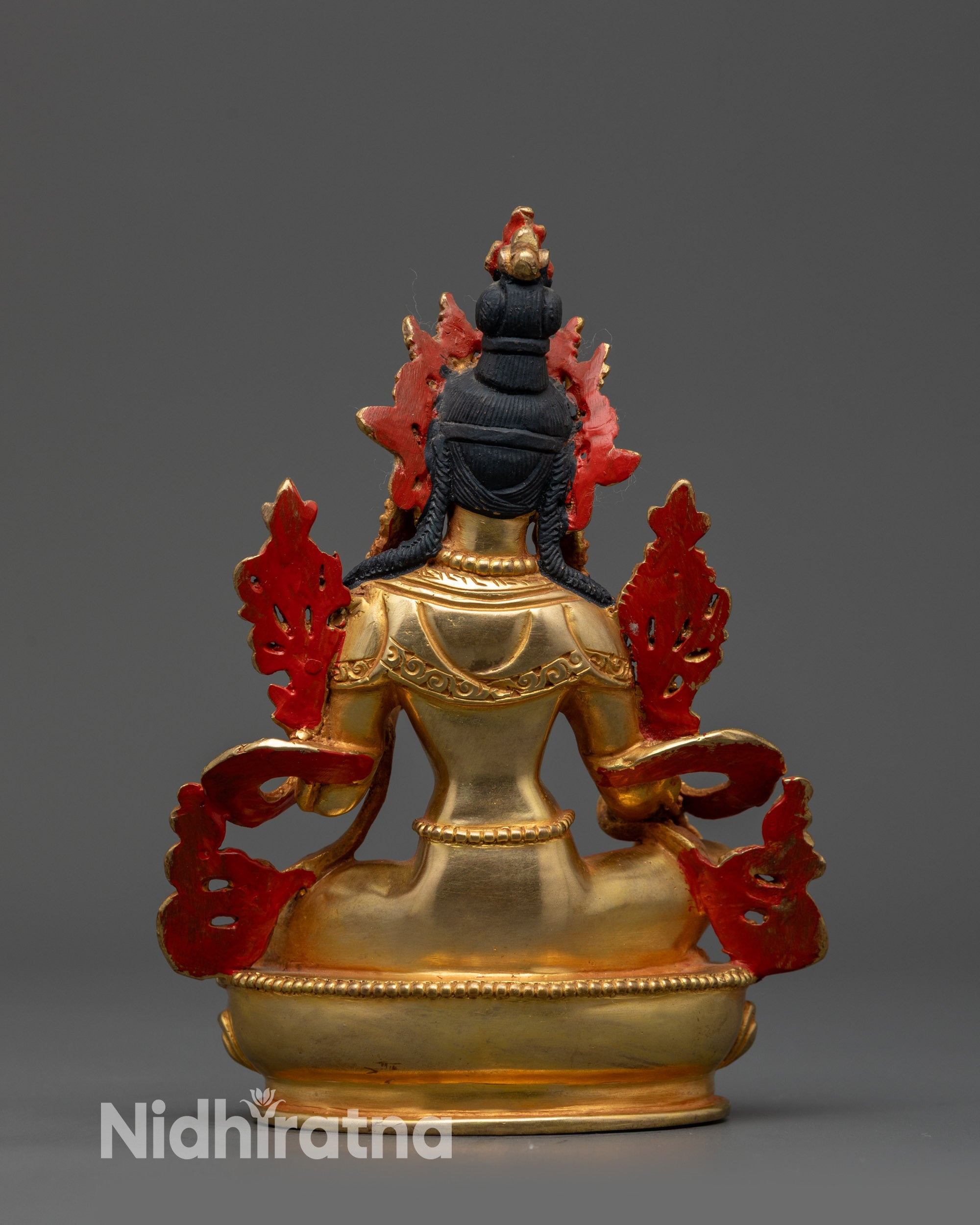 Back view of Green Tara statue highlighting intricate Himalayan artisan craftsmanship