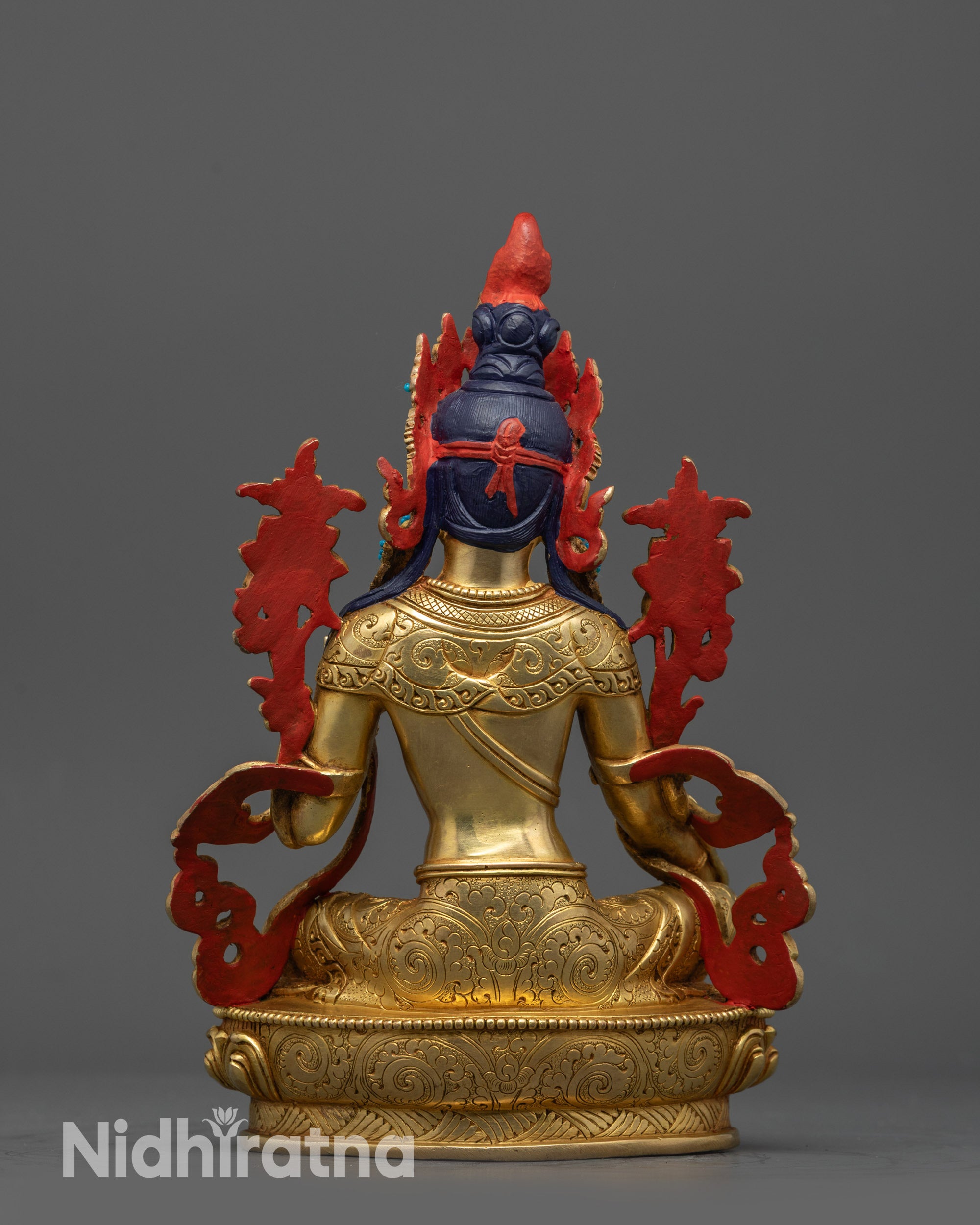 Back view of Green Tara statue showcasing detailed jewelry and lotus seat patterns