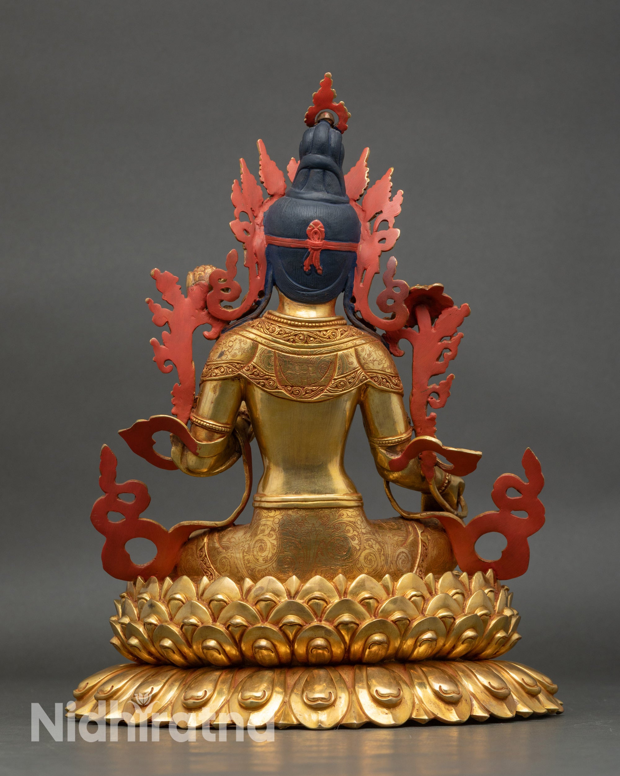 Back view of Green Tara statue with detailed lotus base and artisan craftsmanship