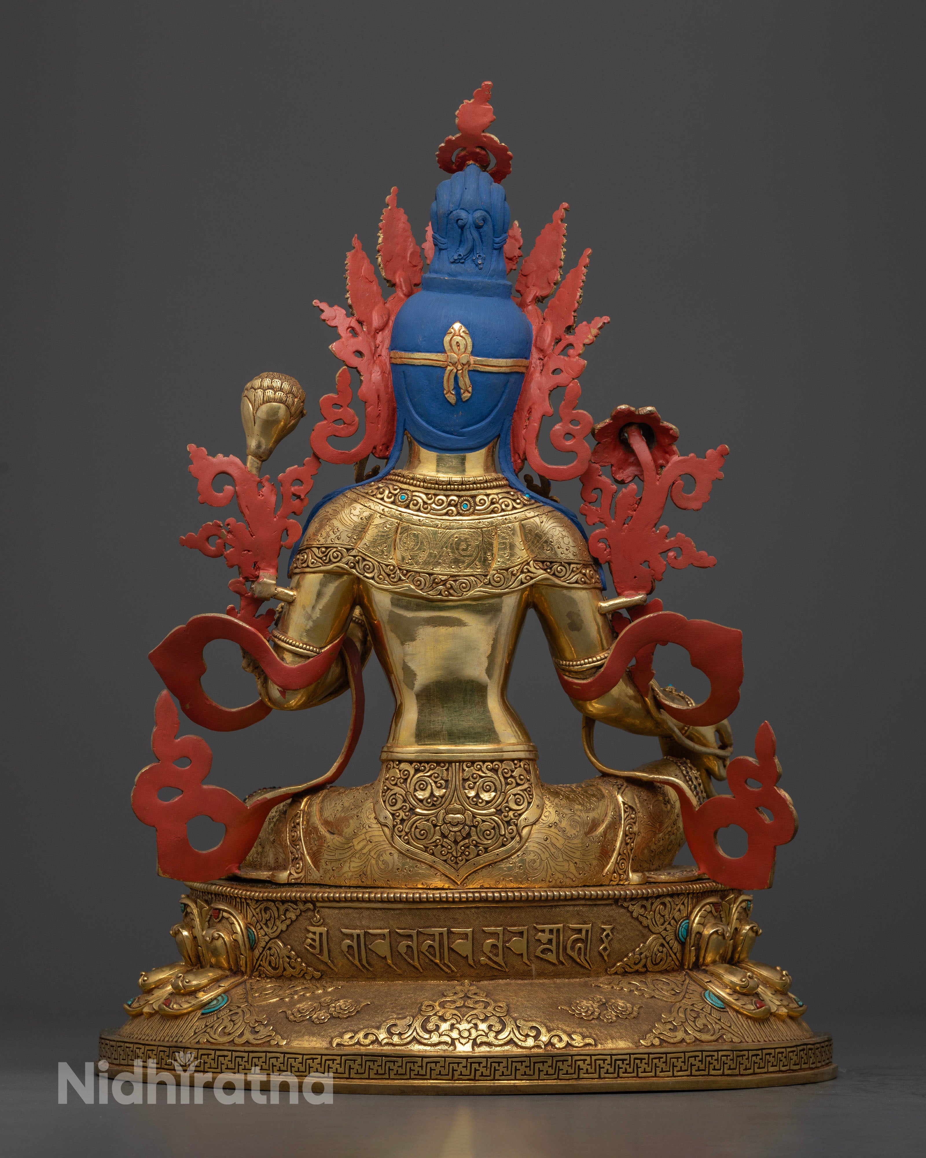 Back view of Green Tara statue with detailed robes and lotus throne, traditional Nepalese Buddhist dΓ©cor