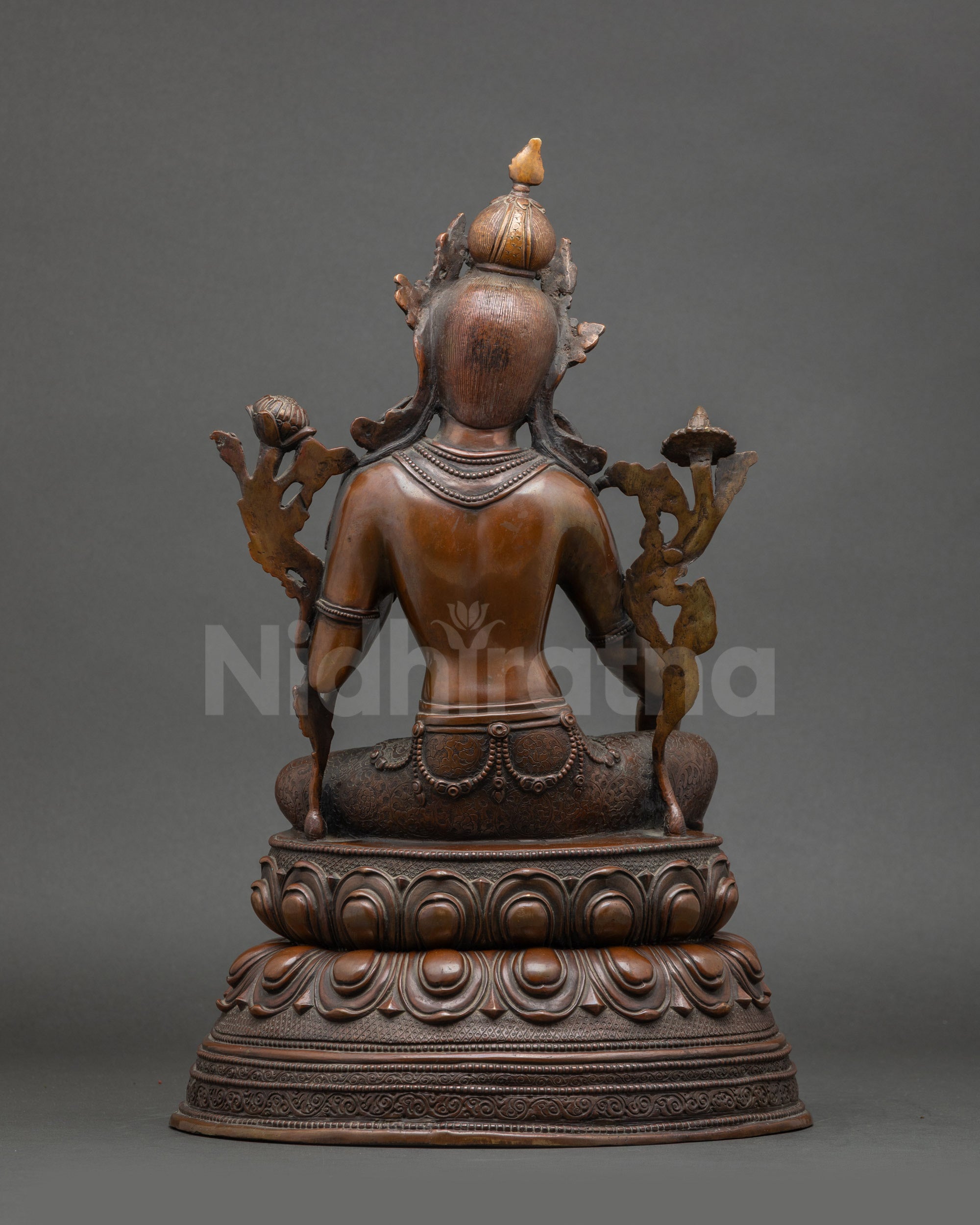 Back view of Green Tara statue with double lotus throne and intricate copper details