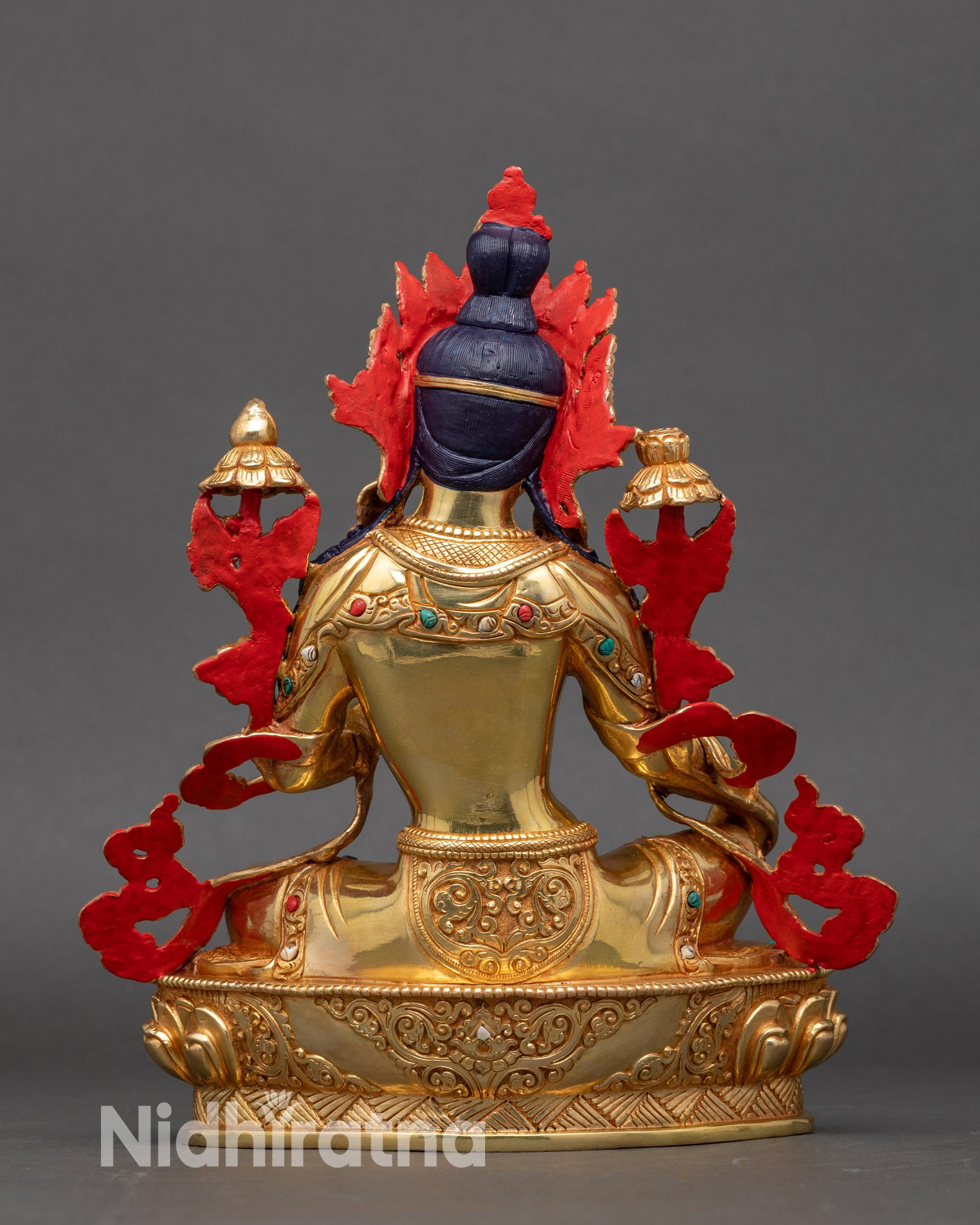 Back view of Green Tara statue with intricate hand carved detailing