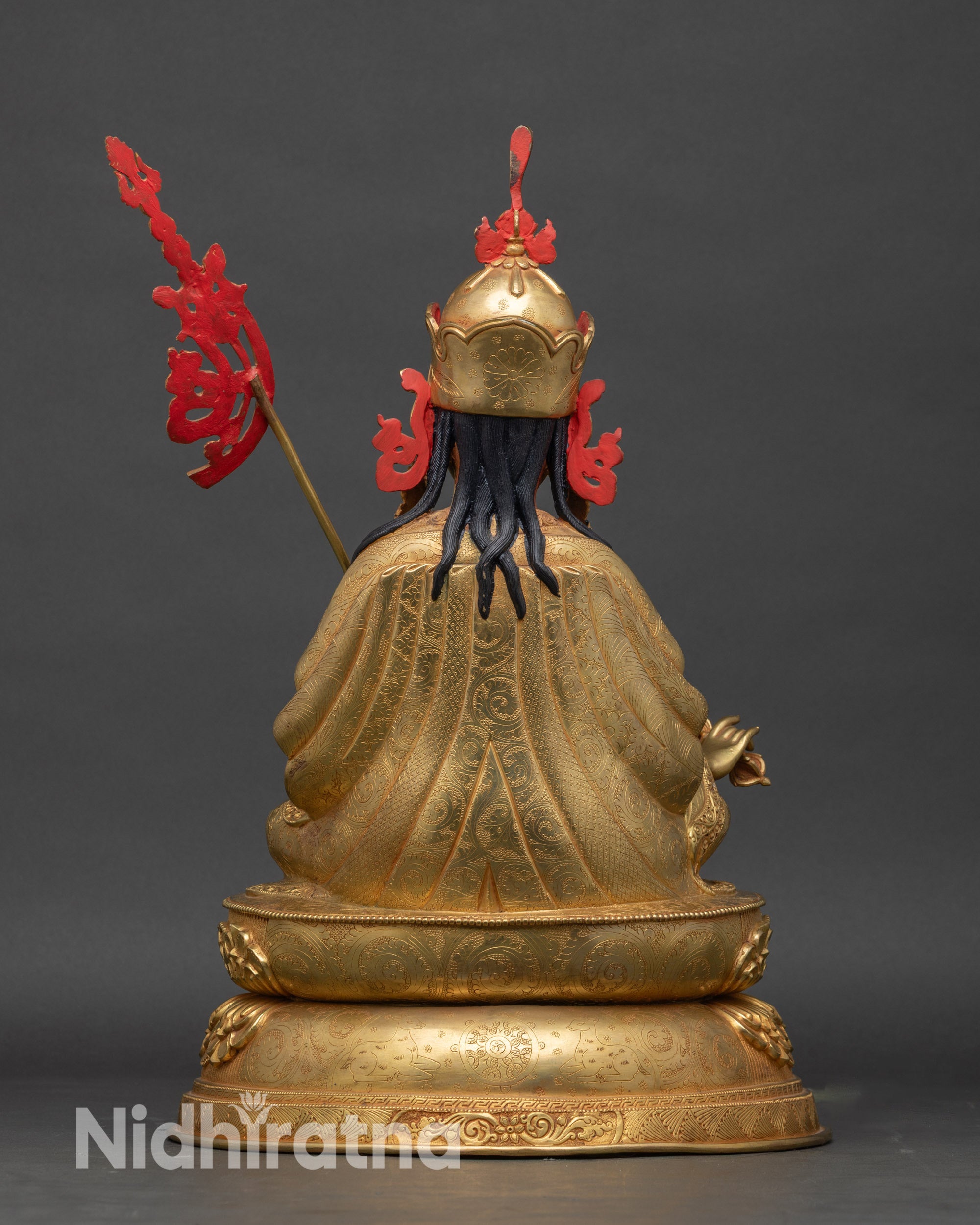 Back view of Guru Rinpoche statue – Nepalese copper and gold Buddhist sculpture showing artisan-crafted robe and pedestal