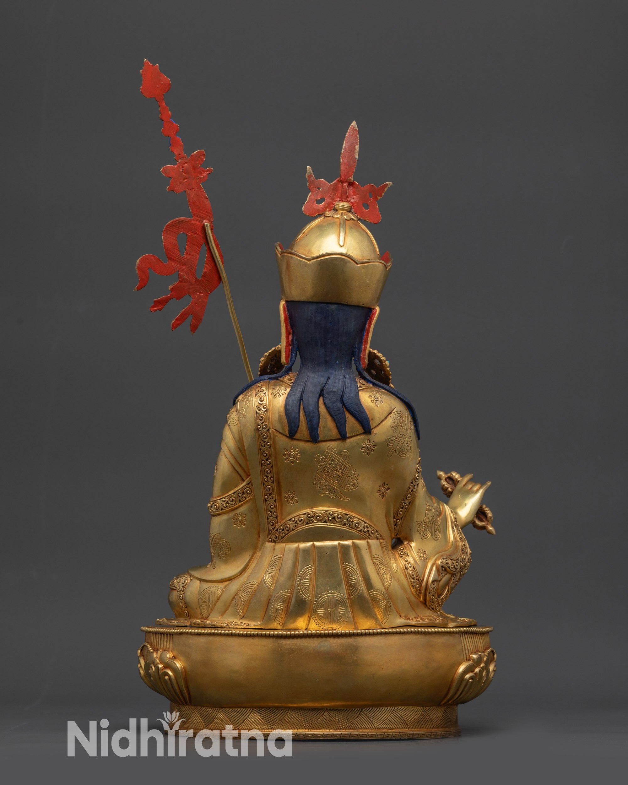 Back view of Guru Rinpoche statue highlighting robe patterns and craftsmanship