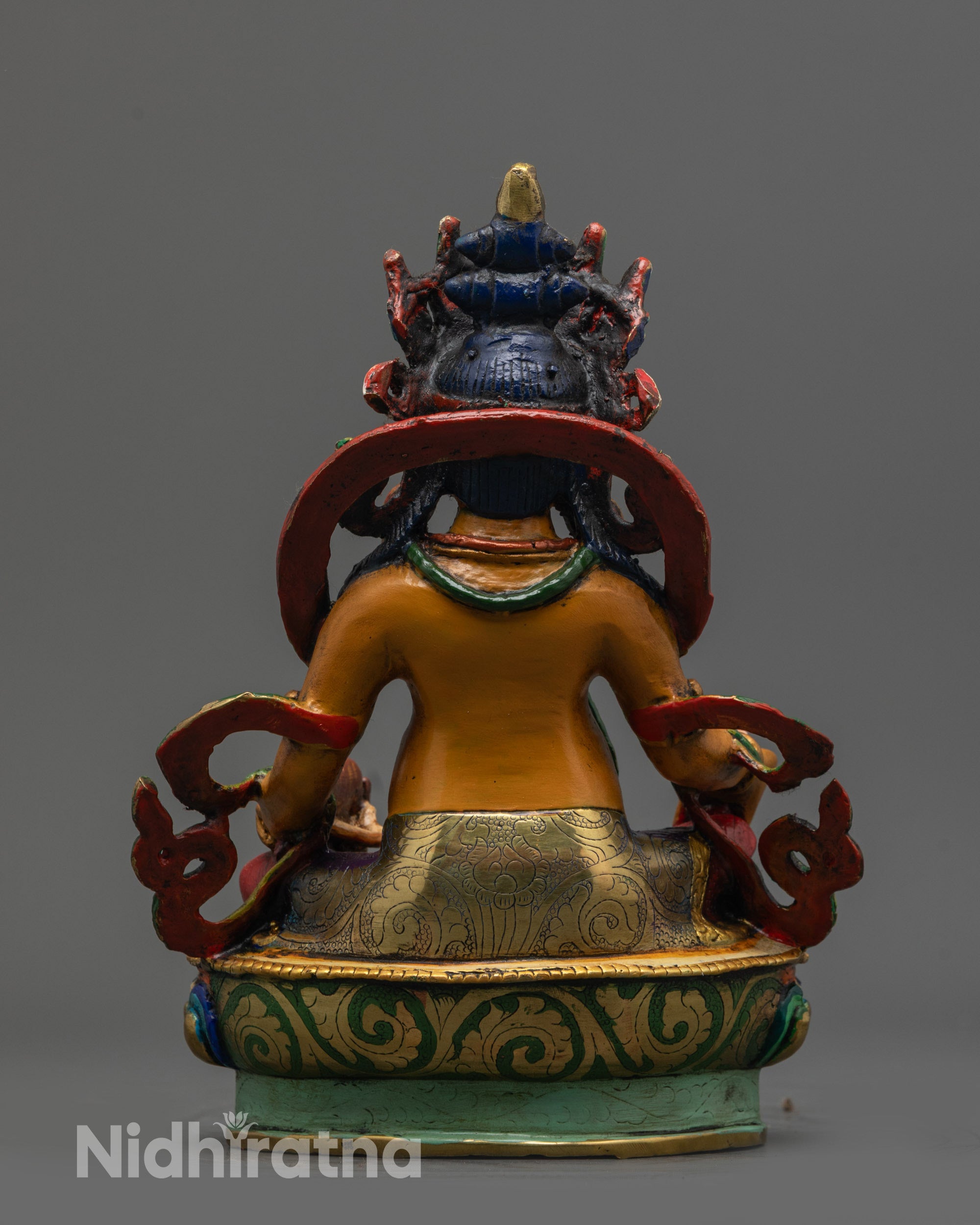 Back view of Hand-painted Dzambhala Statue highlighting intricate lotus seat details