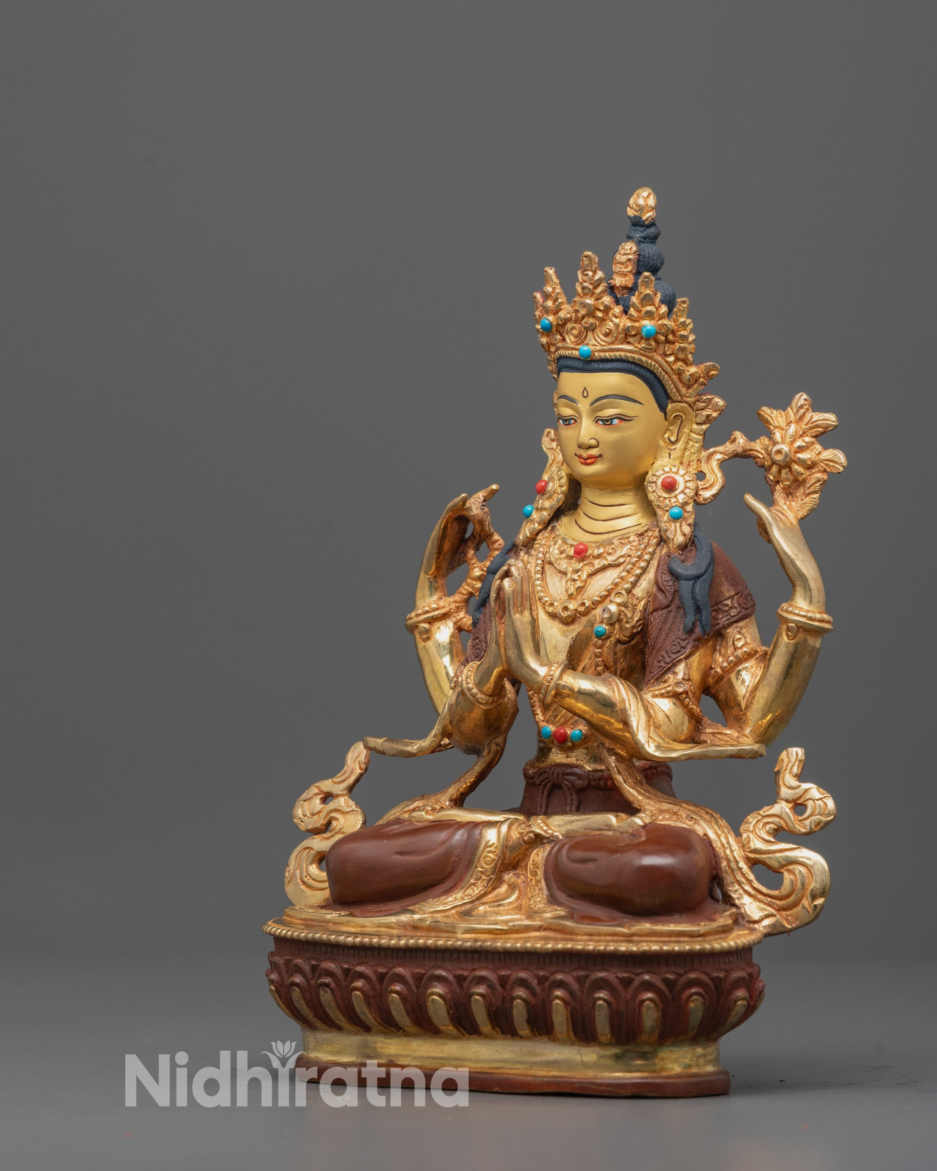 Back view of Himalayan Chenrezig statue highlighting precise lost wax casting details and gold accents.