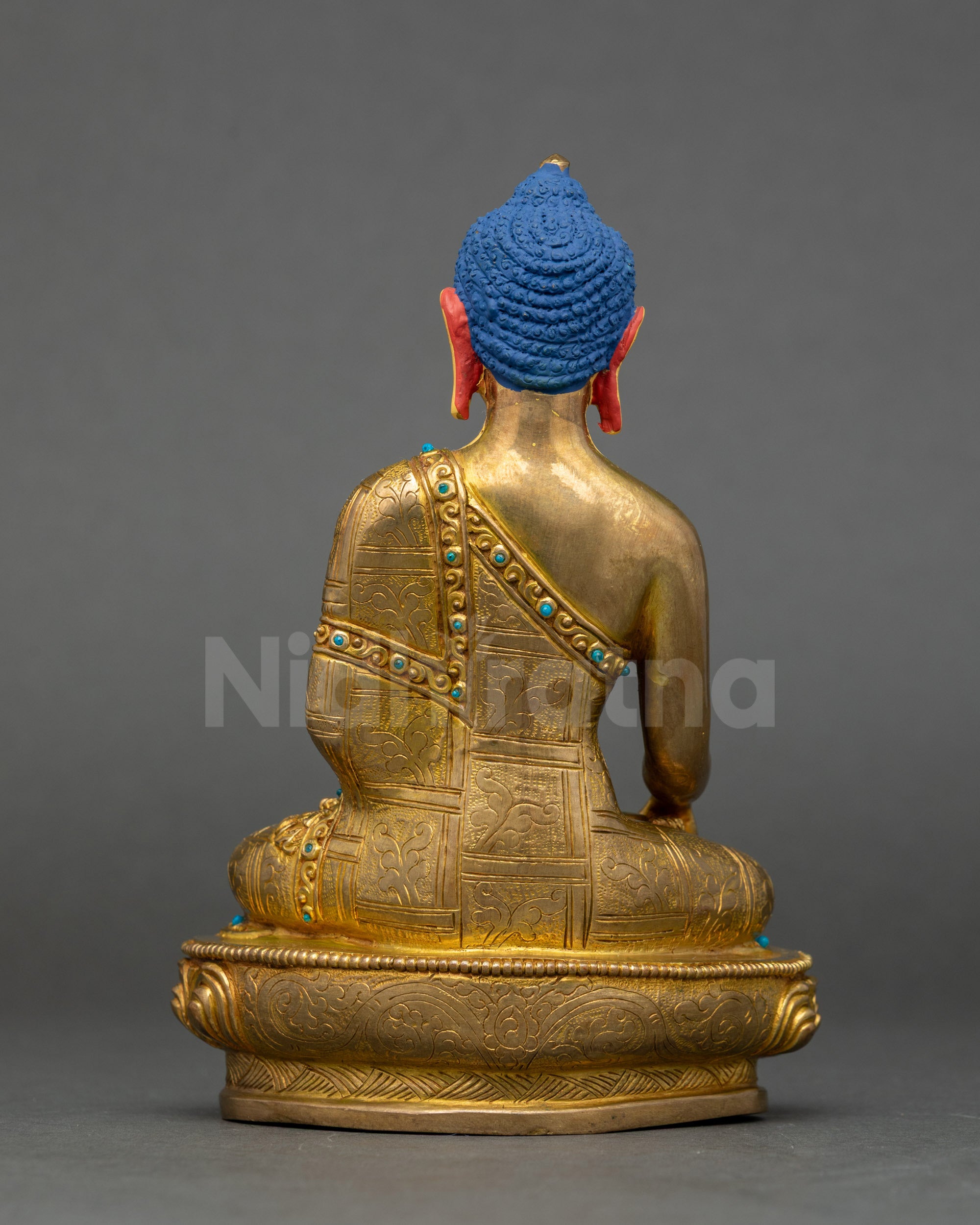 Back view of Himalayan artisan-made Shakyamuni Buddha copper statue with detailed patterns