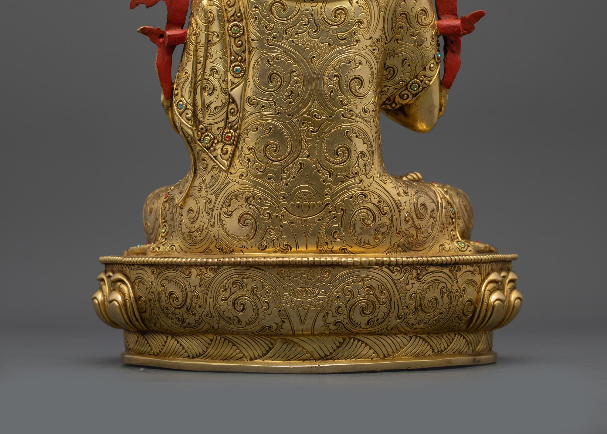 Back view of Khedrup Je statue displaying intricate carvings, gilded details, and fine finish