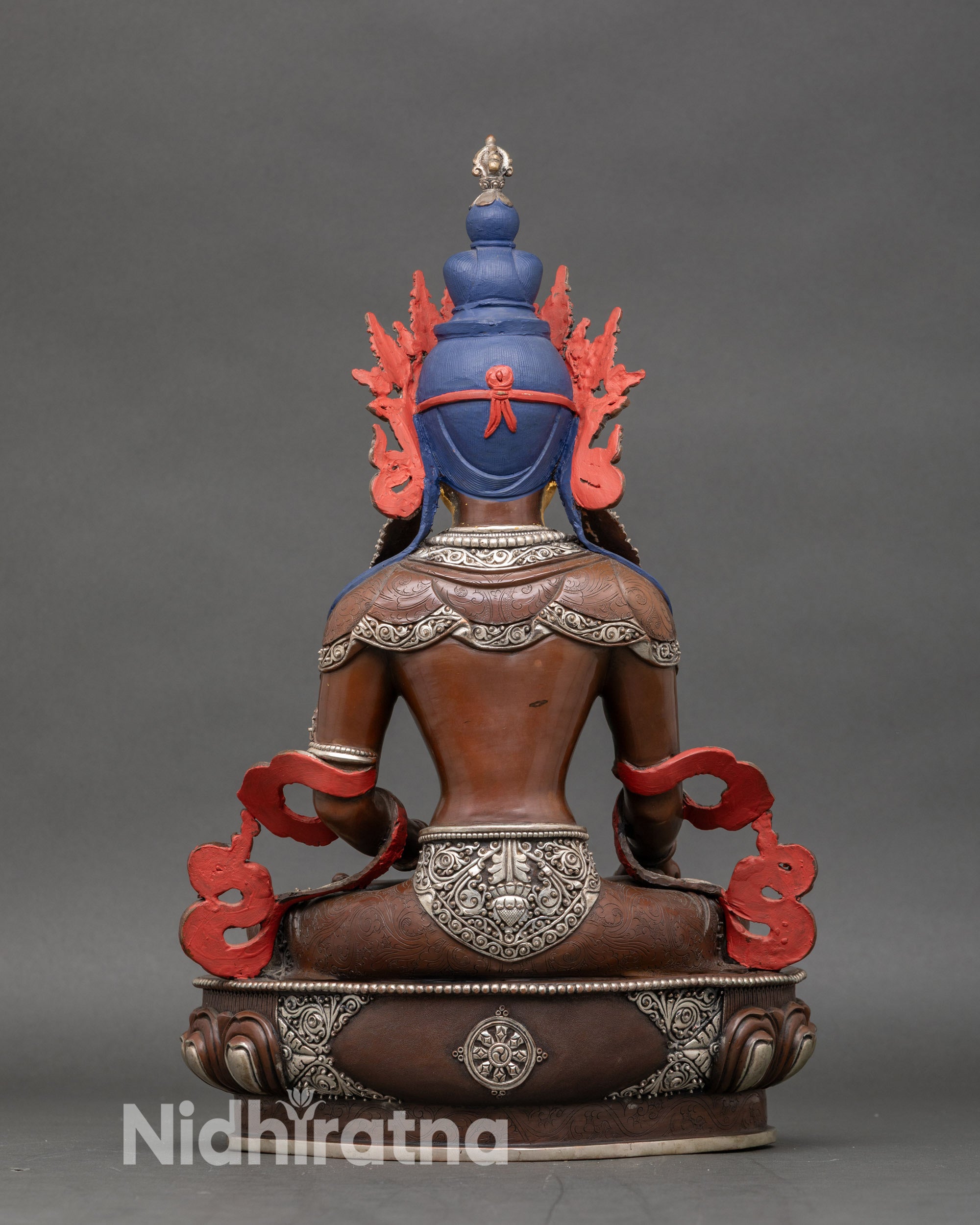 Back view of Kshitigarbha statue showing detailed lotus pedestal carvings