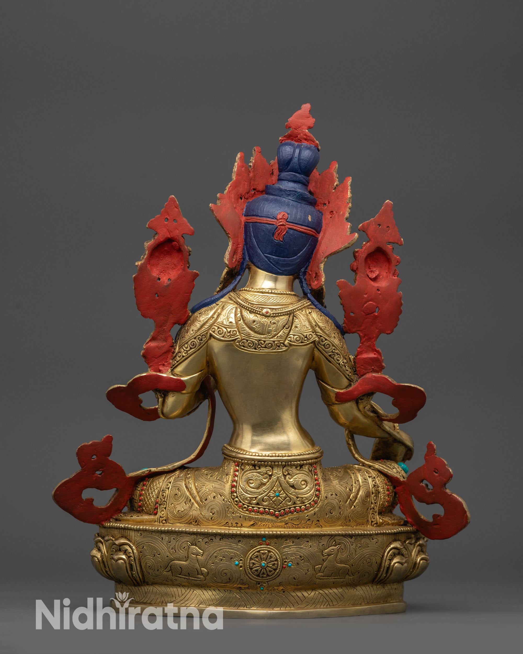 Back view of Liberation Mother Jetsun Drolma statue showing lotus seat and robes