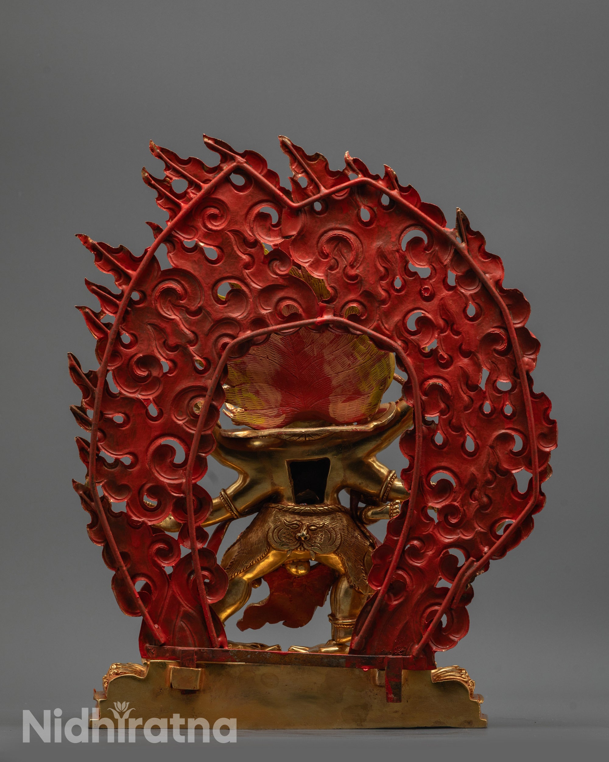 Back view of Mahachakra Vajrapani Consort Statue with blazing halo and carved patterns on seat