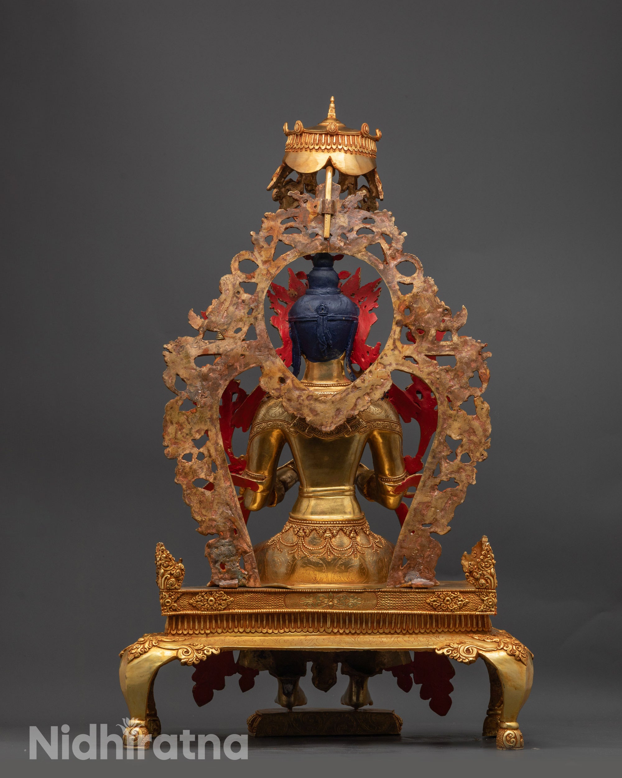 Back view of Maitreya Buddha Statue with carved miniature animals and parasol details