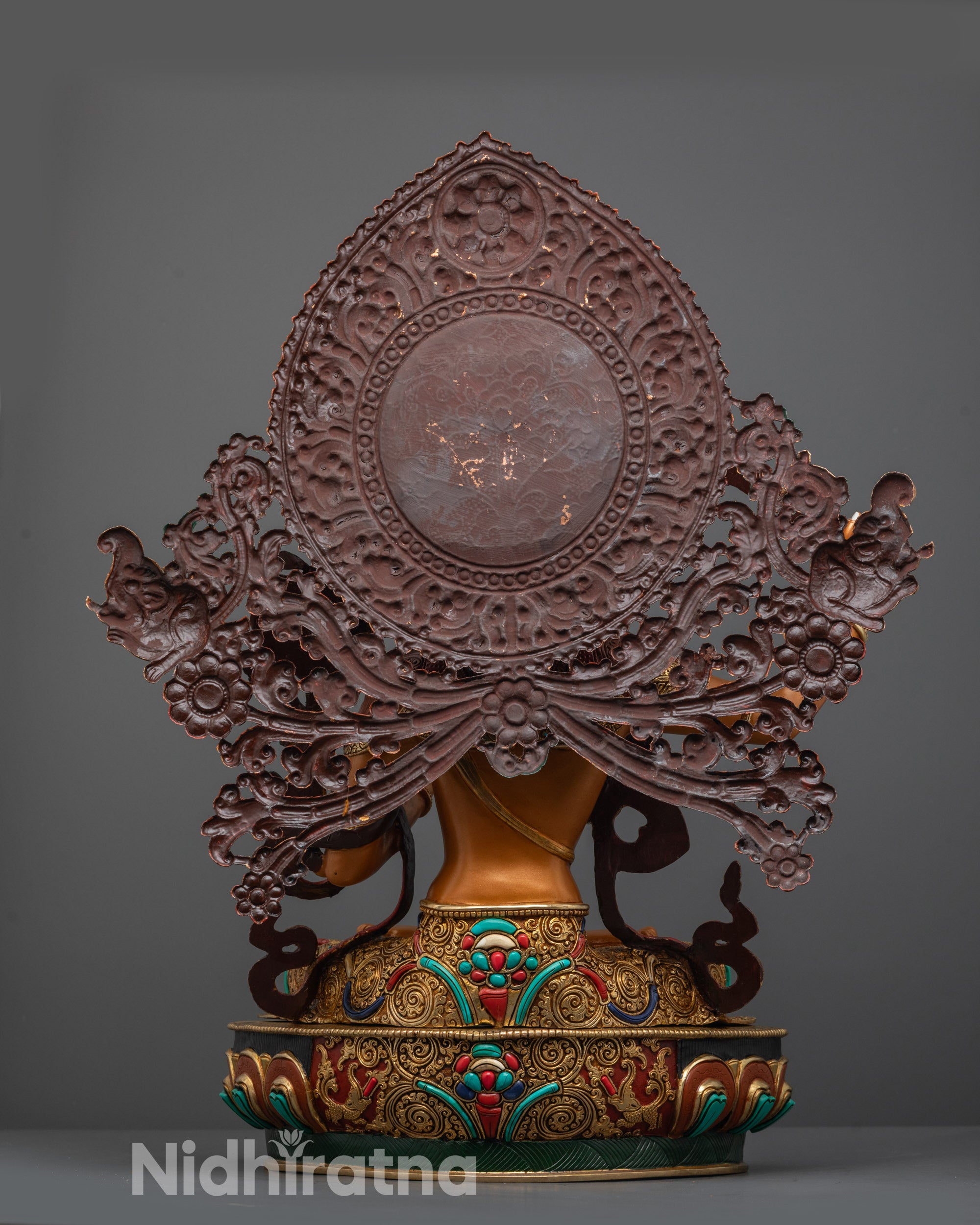 Back view of Manjushri statue highlighting halo with hand-carved flowers and stones