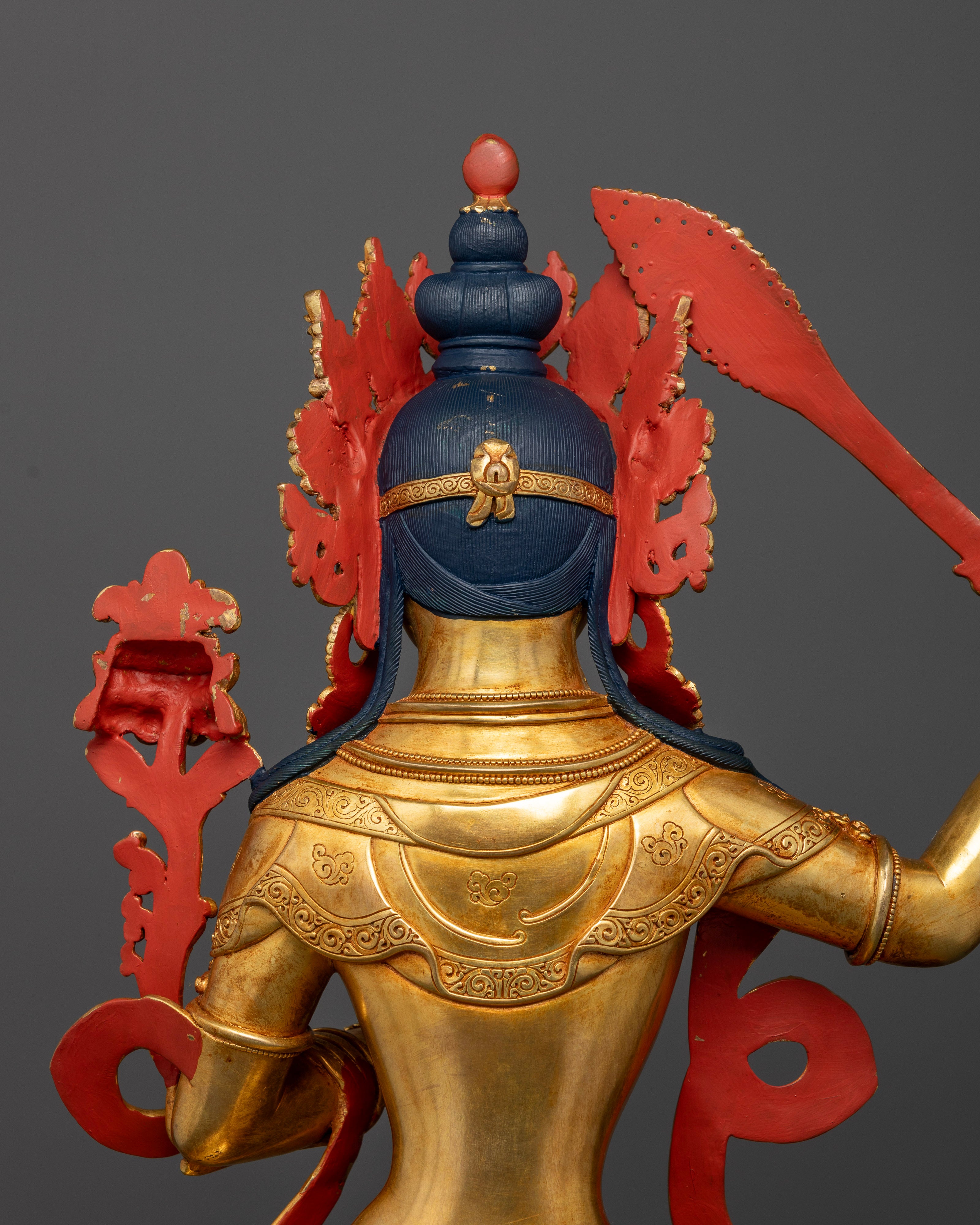 Back view of Manjushri statue highlighting lotus throne and traditional Newar craftsmanship