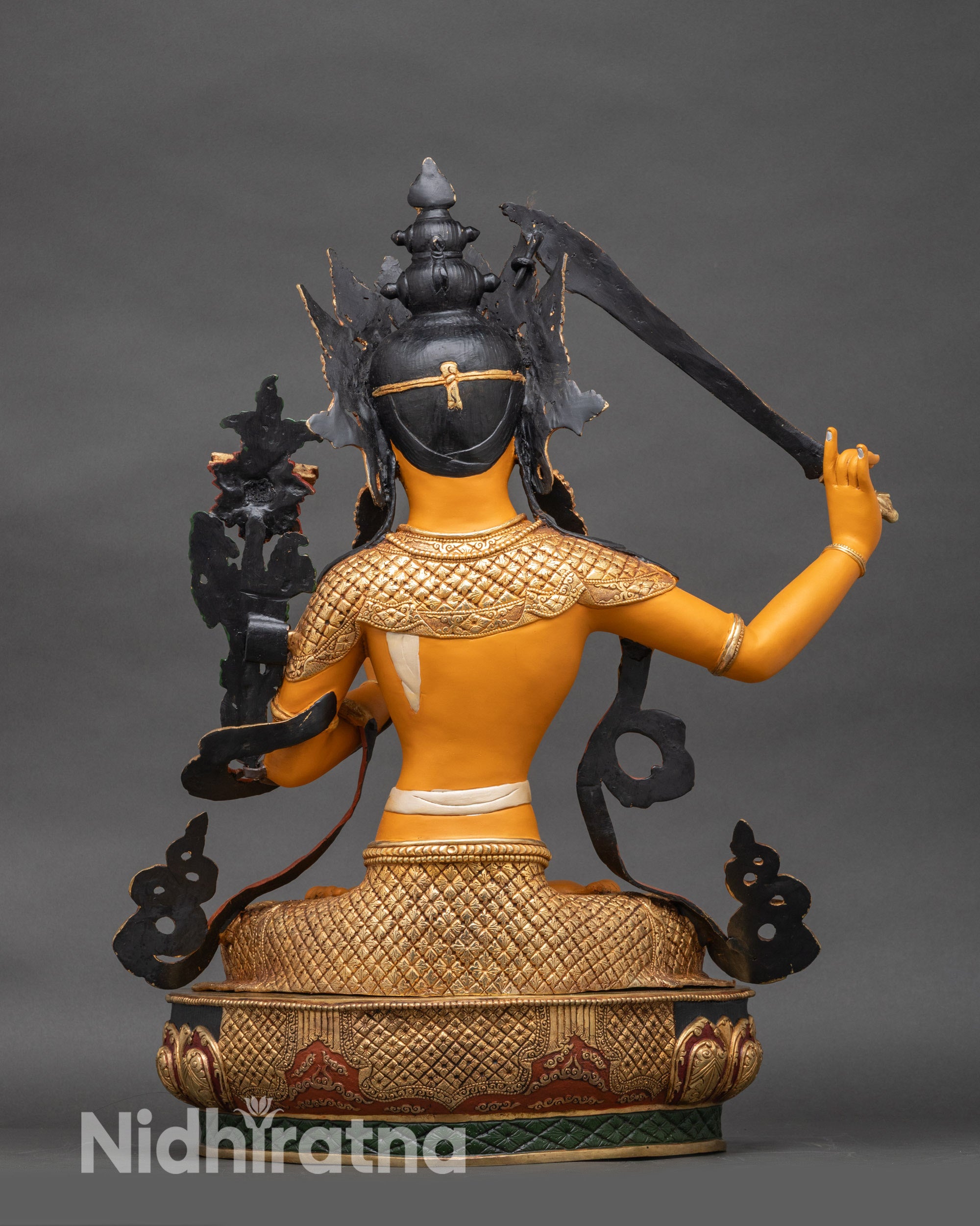 Back view of Manjushri statue, lotus throne and detailed ornamental patterns
