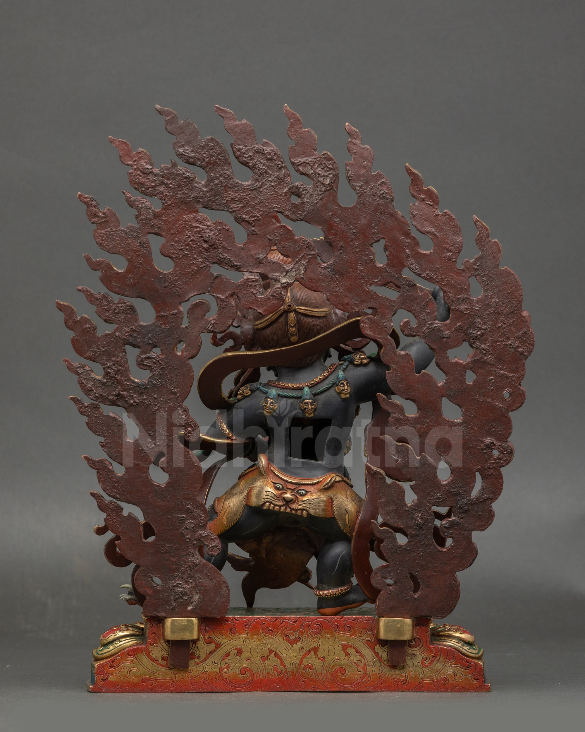 Back view of Manjushri statue showing detailed carvings and matt black body