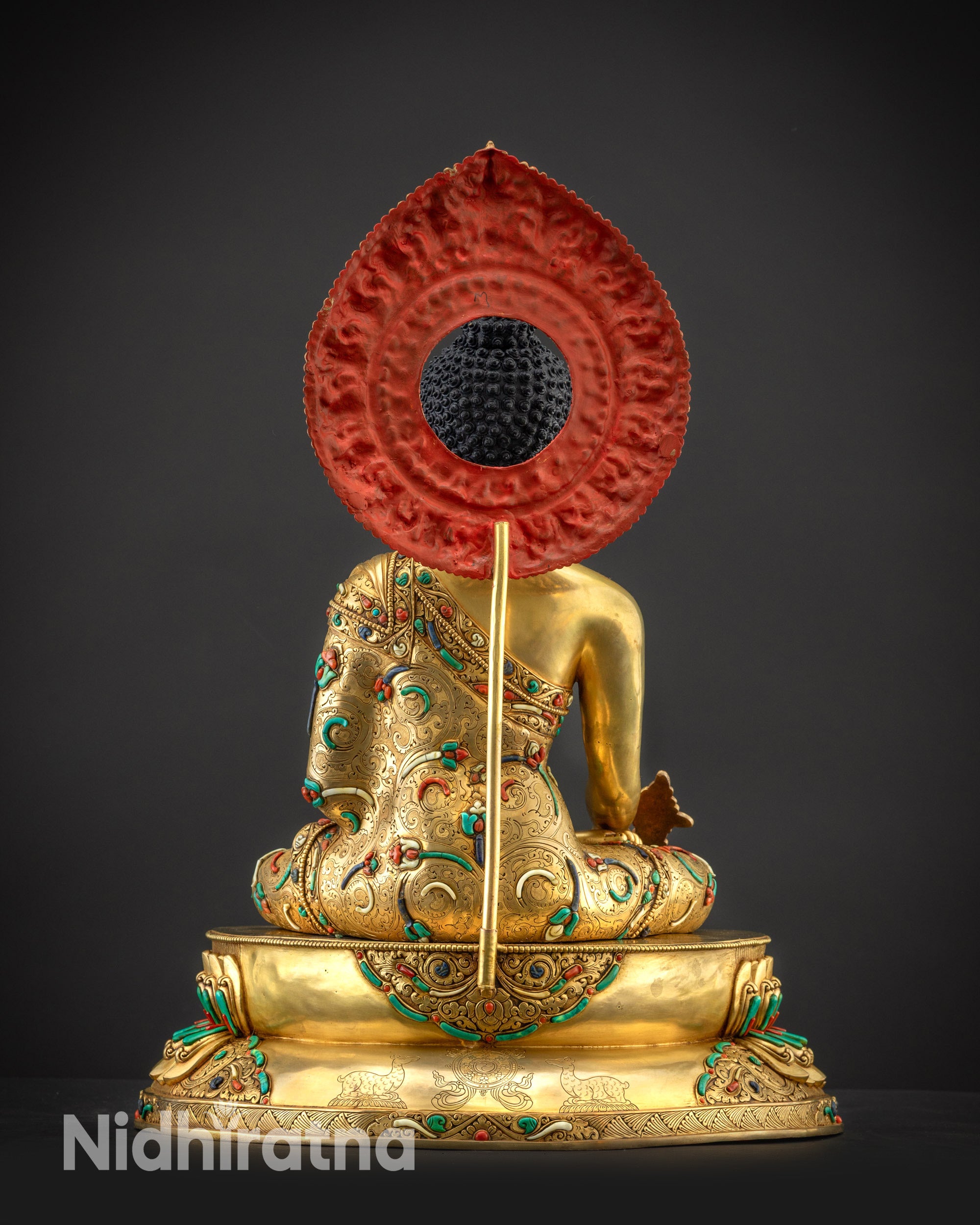 Back view of Masterpiece Medicine Buddha Statue showing carved lotus base and dharma wheel