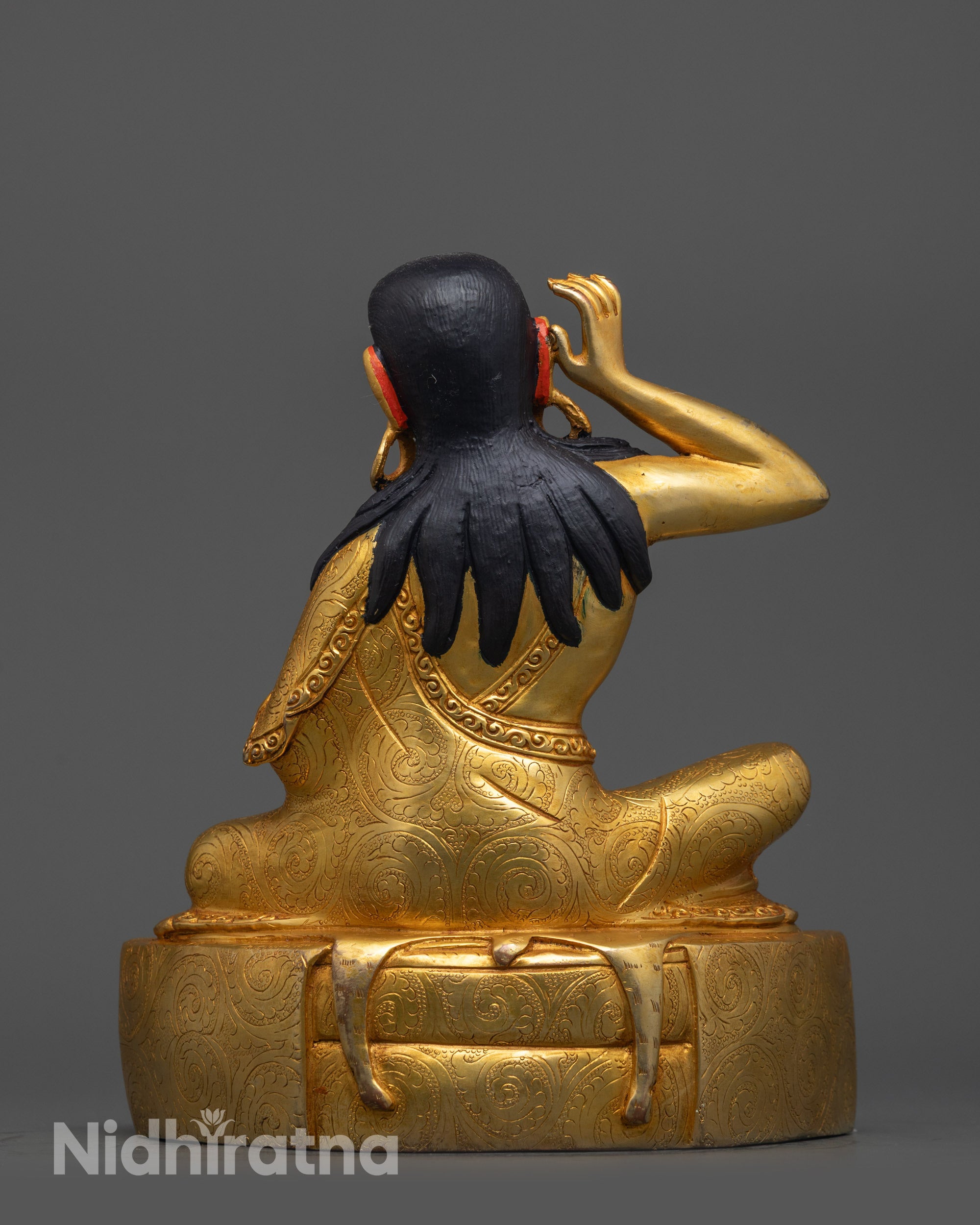 Back view of Milarepa Statue highlighting detailed carvings and craftsmanship of Nepalese artisans